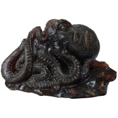 Large 20th century Malaysian Sarawak Borneo Carved Dark Amber Octopus