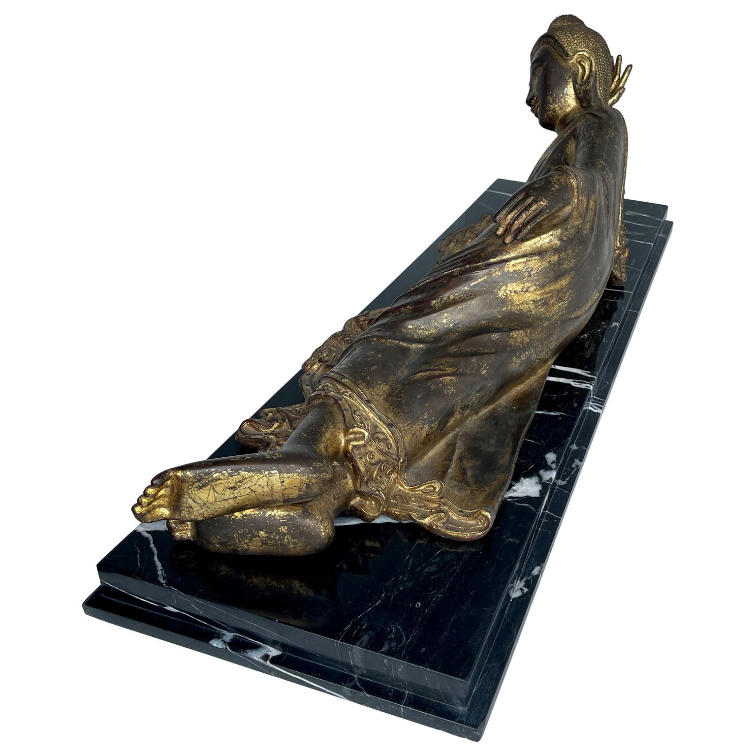 19th Century Large Mandalay Style Gilt Bronze Reclining Buddha Sculpture on Black Marble Base For Sale