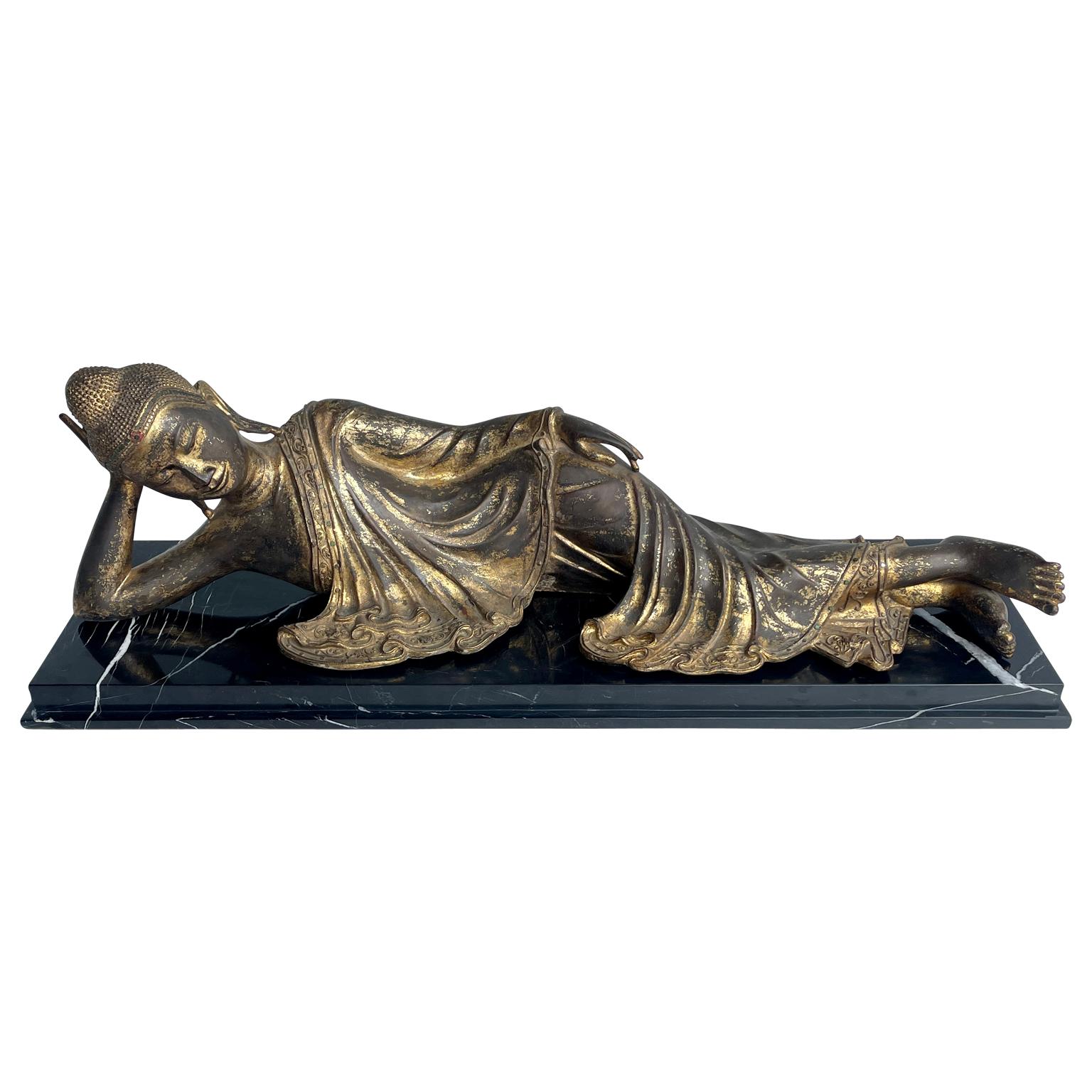 Large Mandalay Style Gilt Bronze Reclining Buddha Sculpture on Black Marble Base In Good Condition For Sale In Haddonfield, NJ