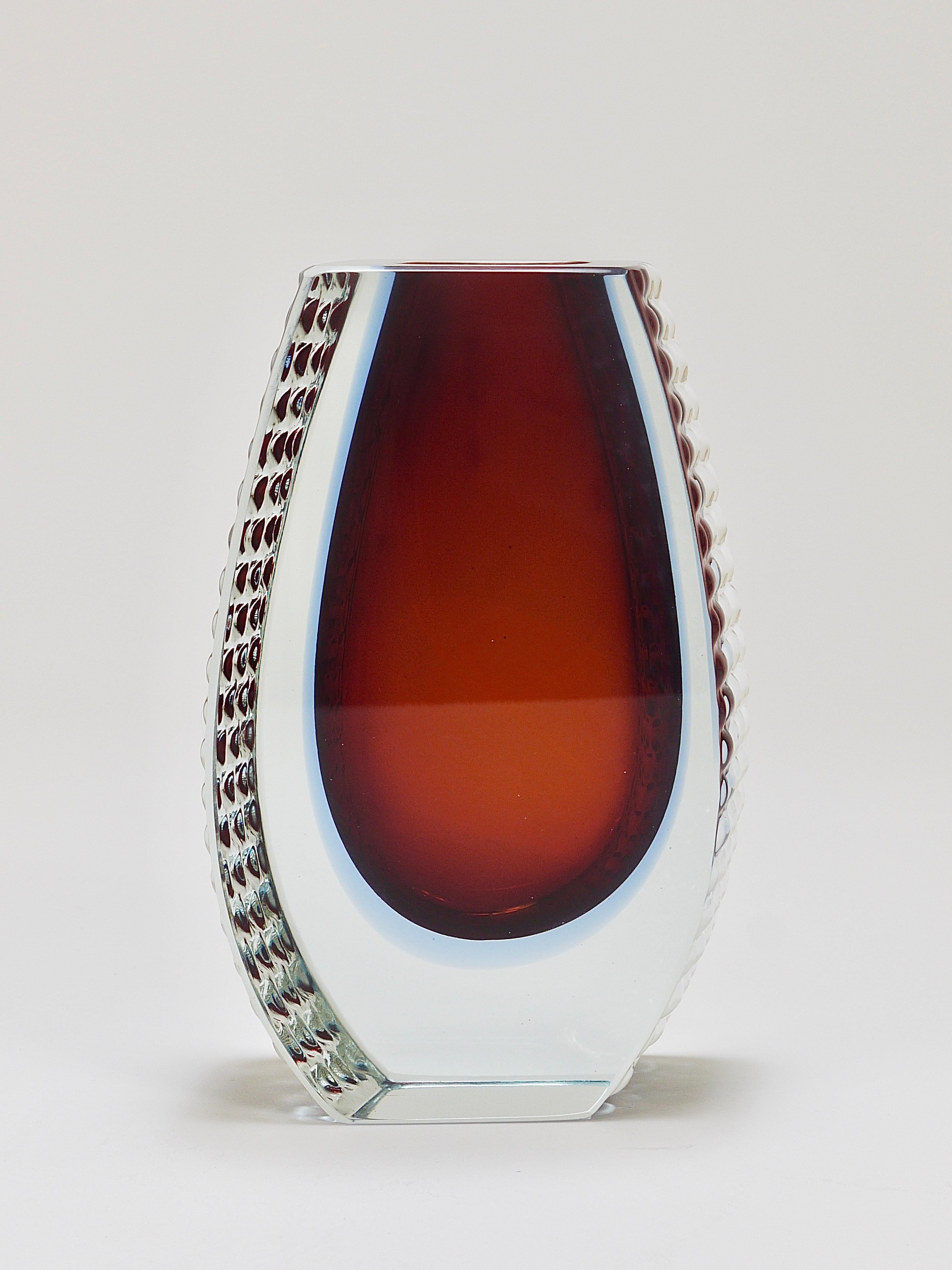 A beautiful and solid Italian Murano glass vase from the 1970s by Alessandro Mandruzzato. It has a wonderful asymmetrical shape with a polished front and back and textured ice glass sides. This is a large sample with a height of 8 in. Handmade with