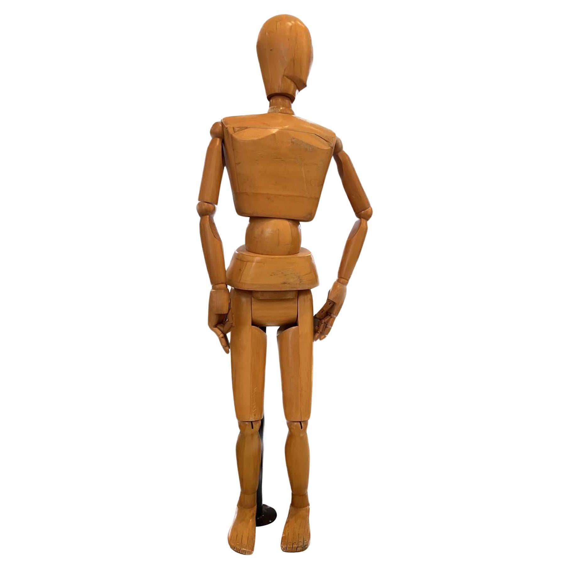 This is a very unique piece. A very large articulated drawing form made from Solid Mable wood. The fingers hands and arms all move. Legs all move as shown in the photos. The Piece includes an adjustable metal stand that attaches to the back of the