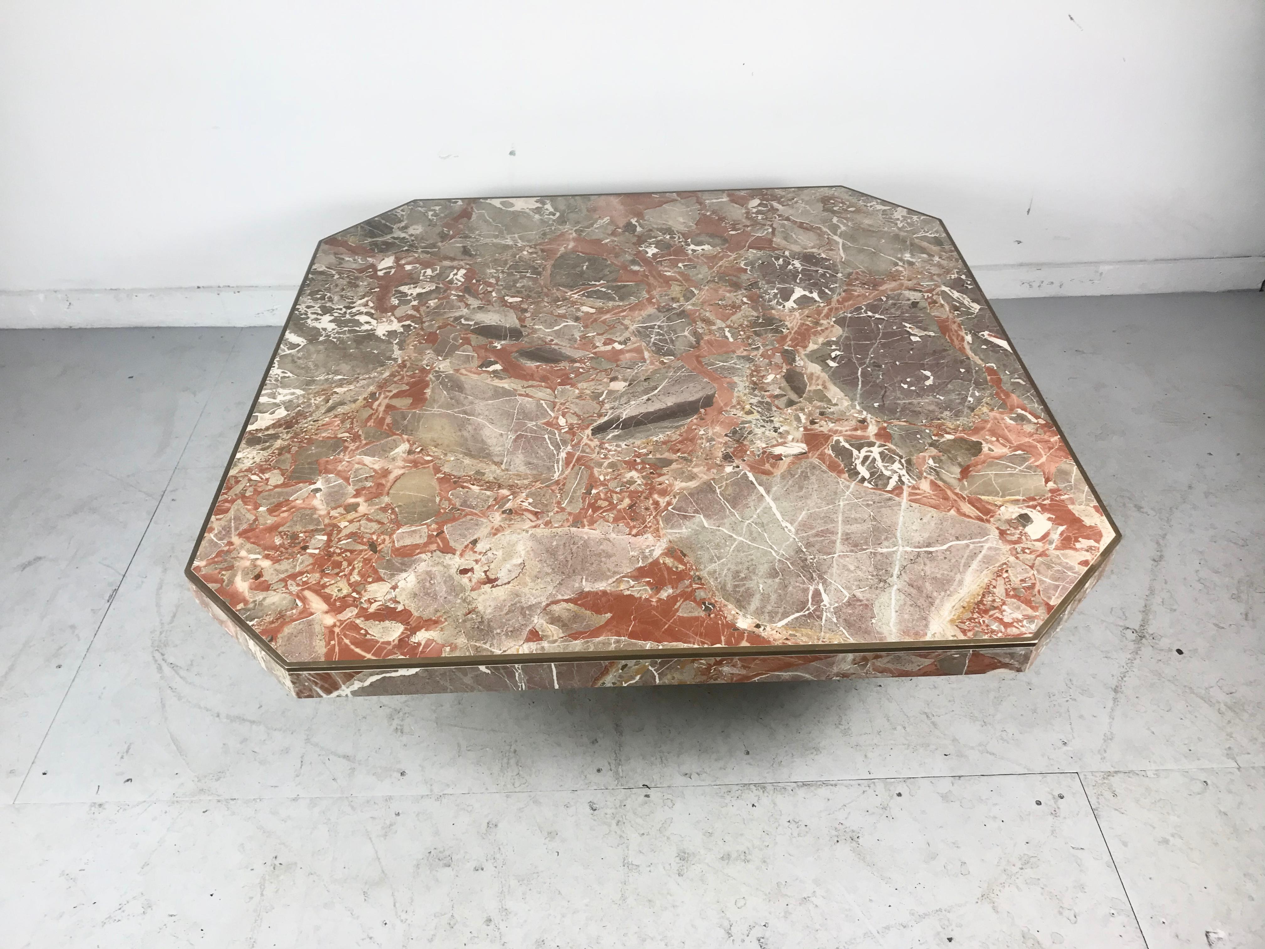 Large coffee / cocktail table with solid slab marble top, brass edges and marble pedestal base by Willy Rizzo, Italian, 1970s. Stunning multi-color Italian marble, hand delivery avail to New York City or anywhere en route from Buffalo NY.