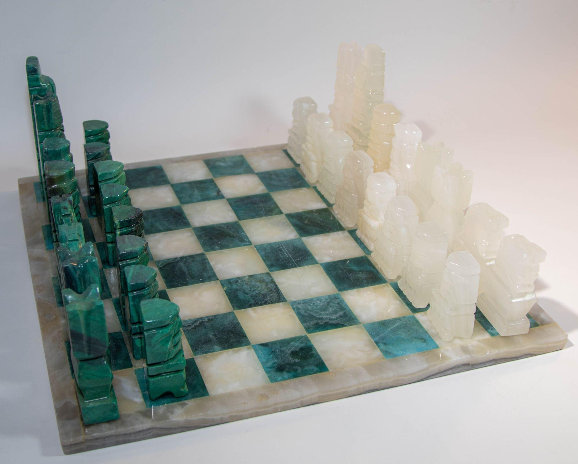 Vintage Marble Large Chess Set with Hand-carved Emerald Green Malachite Onyx Pieces.
Vintage mid 20th century Mexican stone marble chess set complete chess board in green and white marble stone with elaborately hand carved onyx malachite green and