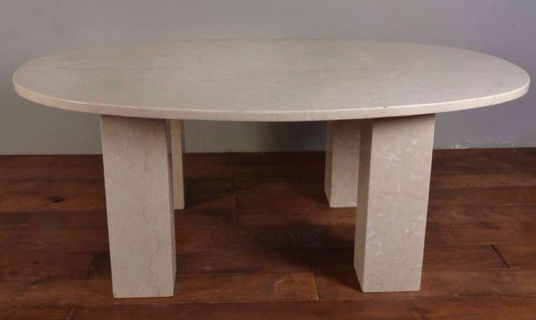 Large white marble veined dining table the oval top raised up on four square sectional supports. Measures: Six-foot.