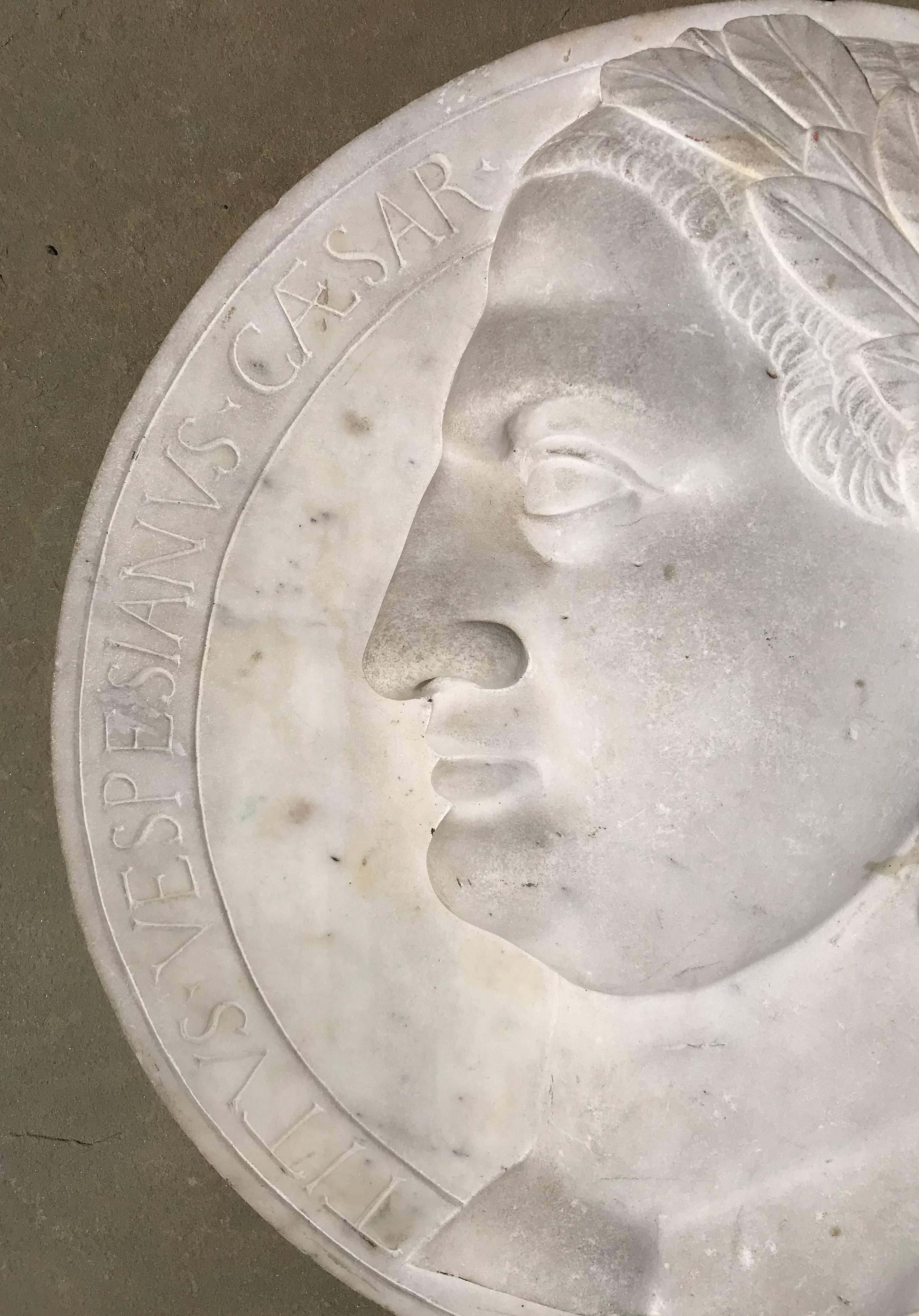Fine neoclassical Italian 16” diameter relief plaque of Caesar Augustus dating to the early 19th century.
The deeply carved head of Caesar is decorated with a laurel wreath and surrounded with a Latin inscription: “Caesar Augustus Imperator Titus