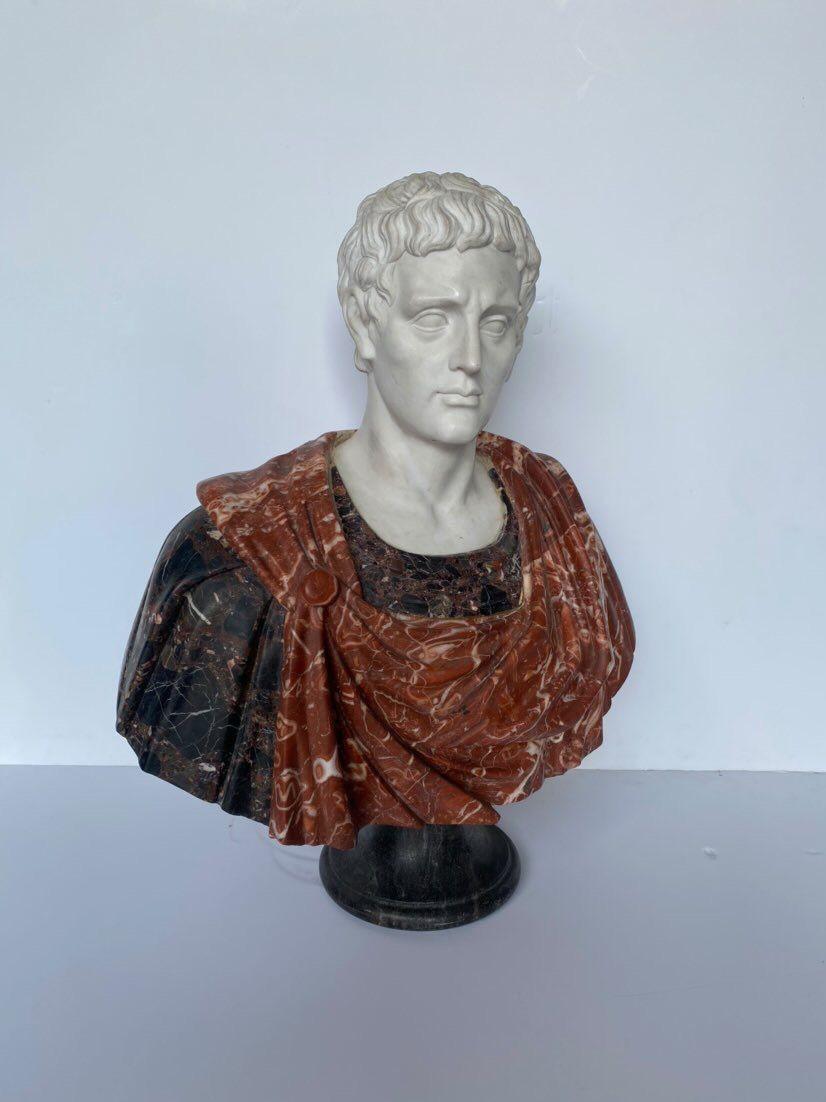 Large black, red, and white marble specimen bust of Julius Caesar. 
 
Dimensions:
 
35