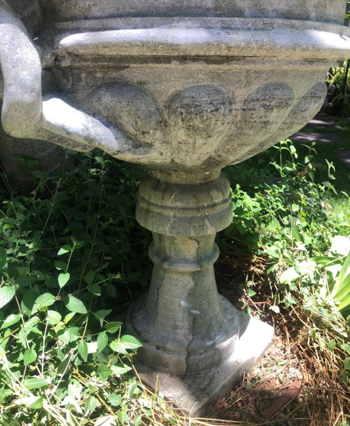 This is a one of a kinda eye catching planter.
Very large carved stone (possibly unpolished Cipollino Marble) Tazza Urn/Jardiniere. 
Top portion removable from pedestal. 
Handles are two twisted snakes/serpentine coils.

Substantial stoup