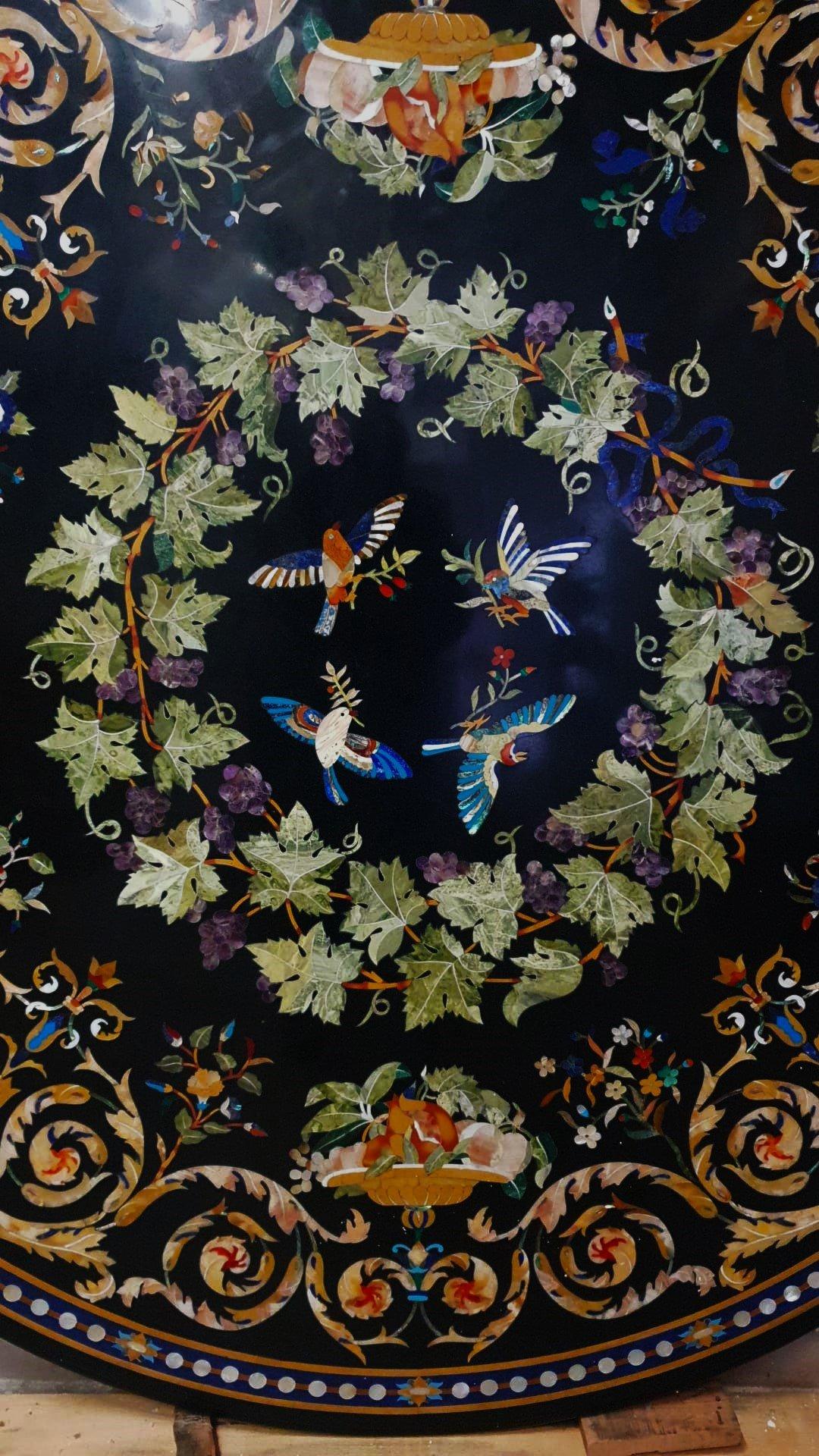 Large marble top, 180cm in diameter, inlaid with semiprecious stones, onyx, lapis lazuli, aquamarine green, antique yellow, mother of pearl, etc. ADDITIONAL PHOTOS, INFORMATION OF THE LOT AND SHIPPING INFORMATION CAN BE REQUEST BY SENDING AN