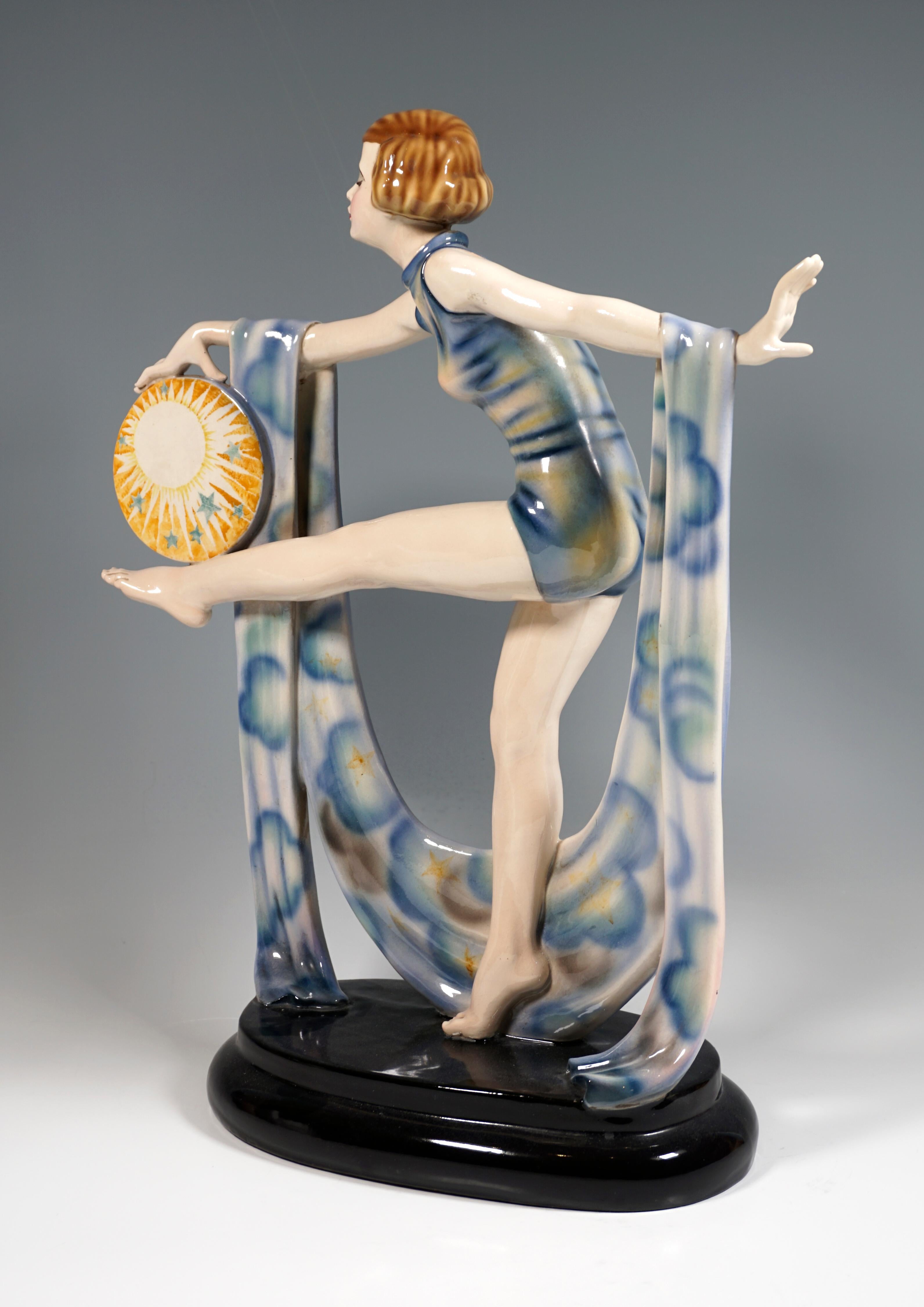 Very rare Marcell Goldscheider Vienna figurine.
Girl in light blue leotard balancing on the right leg, the left leg stretched out horizontally, on it holding a disc with a sun motif and stars with the right stretched out hand, holding on the front