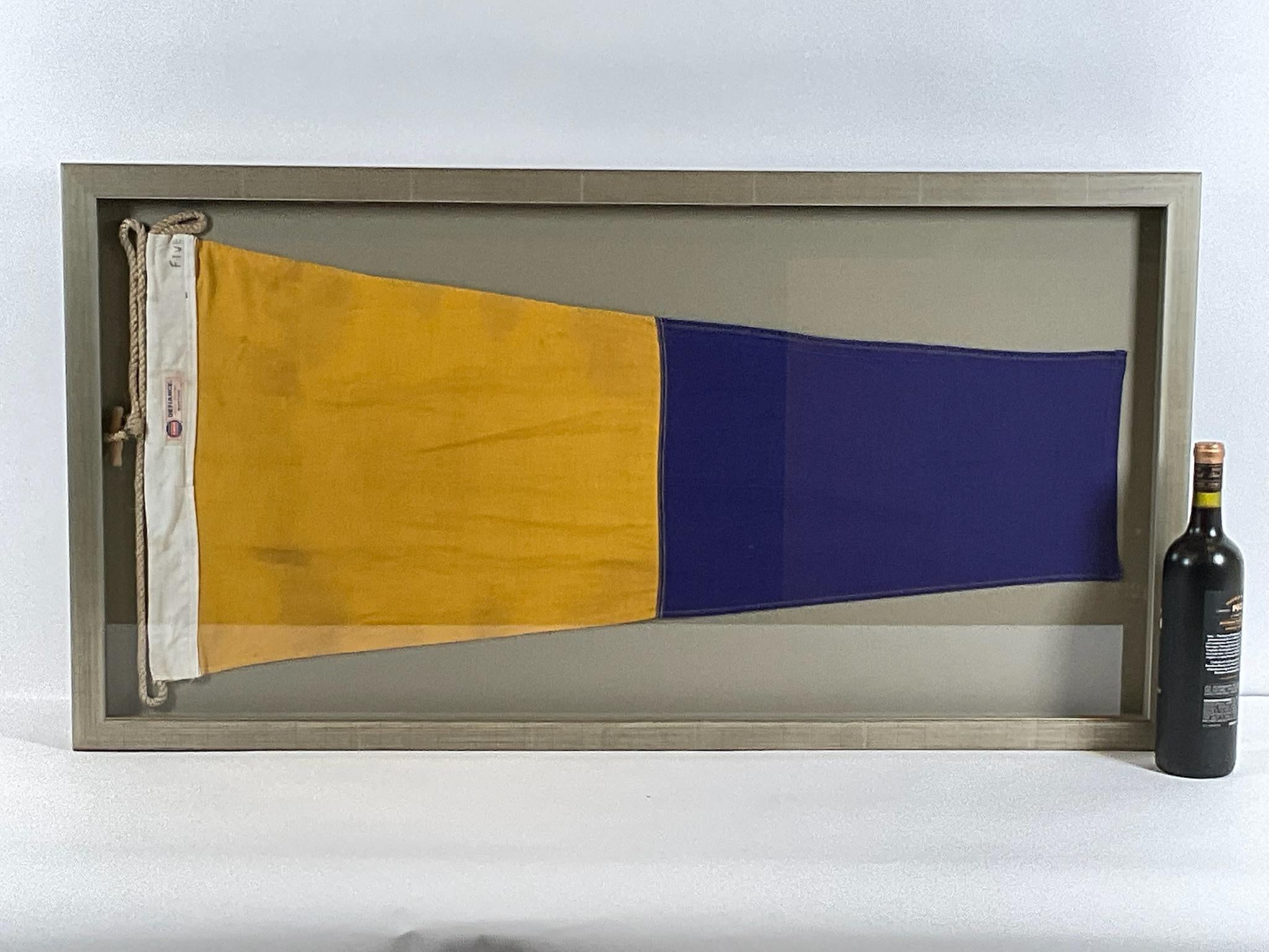 Large linen nautical signal flag representing numeral FIVE. Stitched in panels of blue and yellow. White canvas hoist with manila rope and wood toggle. Big dimensions. Circa 1955.

Weight: 13 lbs.
Overall Dimensions: 22