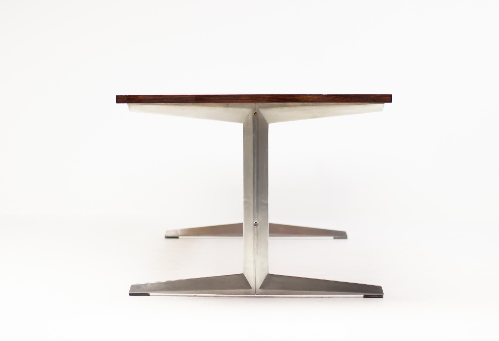 Monumental conference table in rosewood designed in 1970 by Marius Byrialsen for Nipu Møbler.
Aluminium base with rosewood stretcher.
  