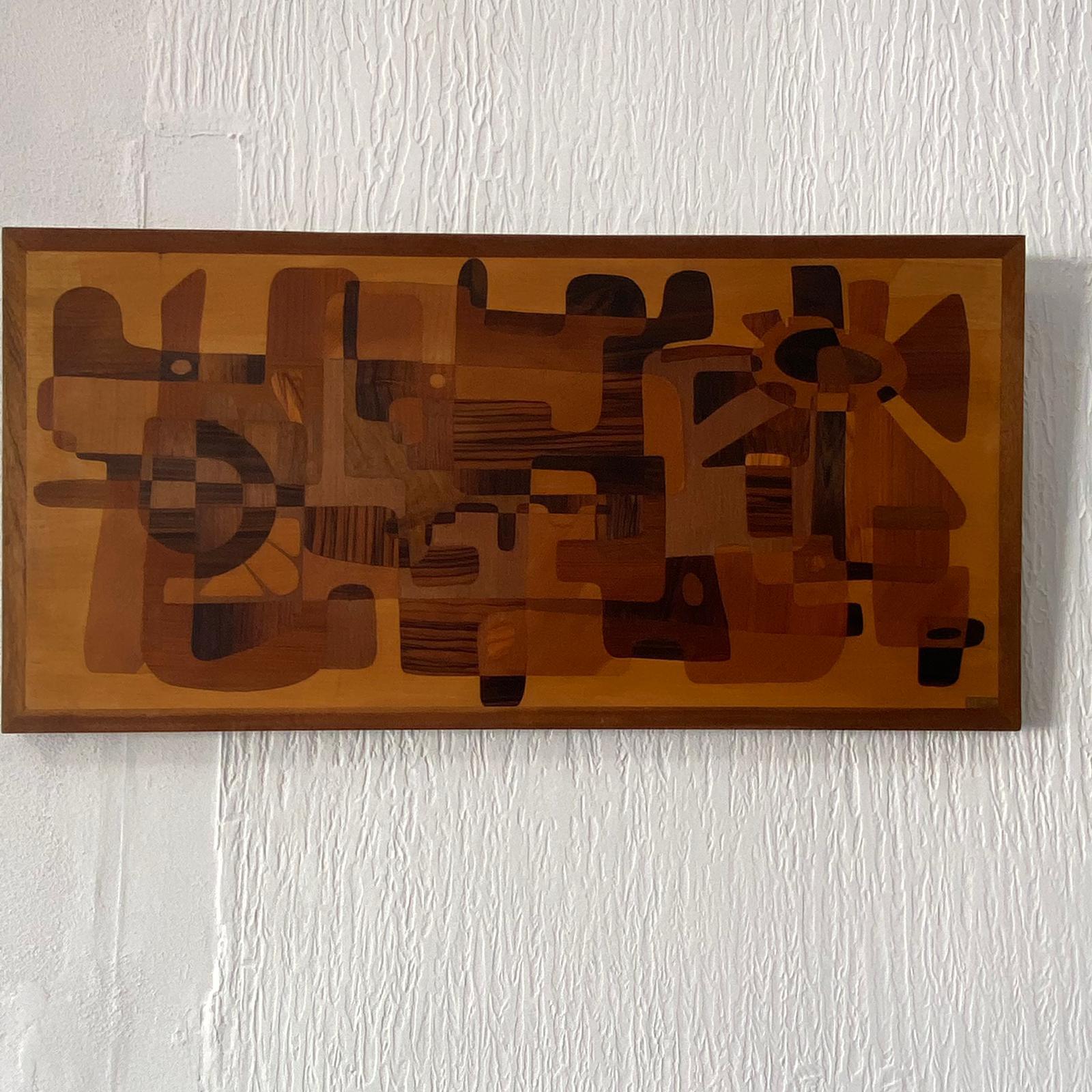 A stunning and large piece of wall art that is in such harmony with any home. Amazing quality and design, this piece dates from the 60-70's It is clearly made by a skilled wood worker artist. the shapes are interesting and the overall deign is