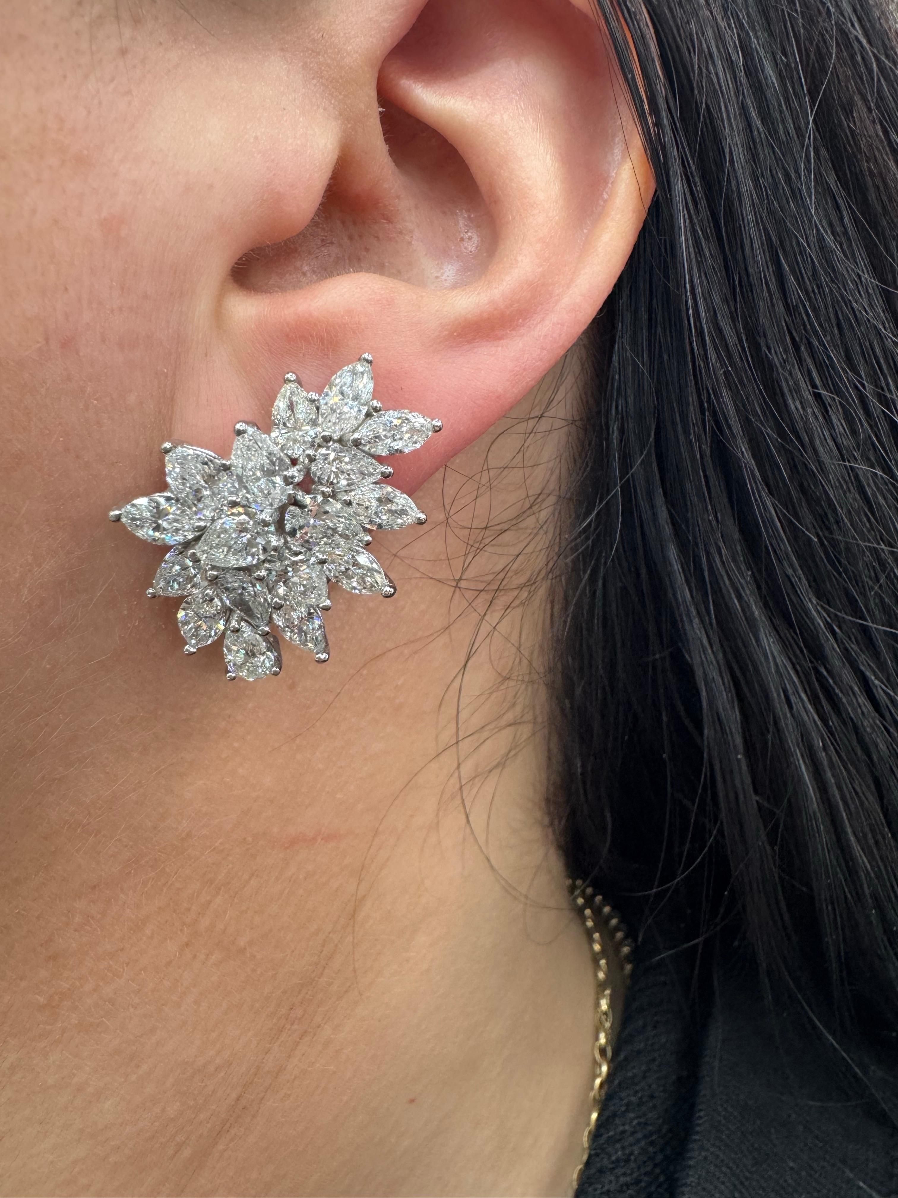 These exquisite statement earrings dazzle with a total of 11.01 carats of perfectly matched Marquise and Pear-shaped diamonds, with exceptional quality of F Color and VS Clarity. Set in luxurious 18 karat white gold, the dynamic, floral-inspired
