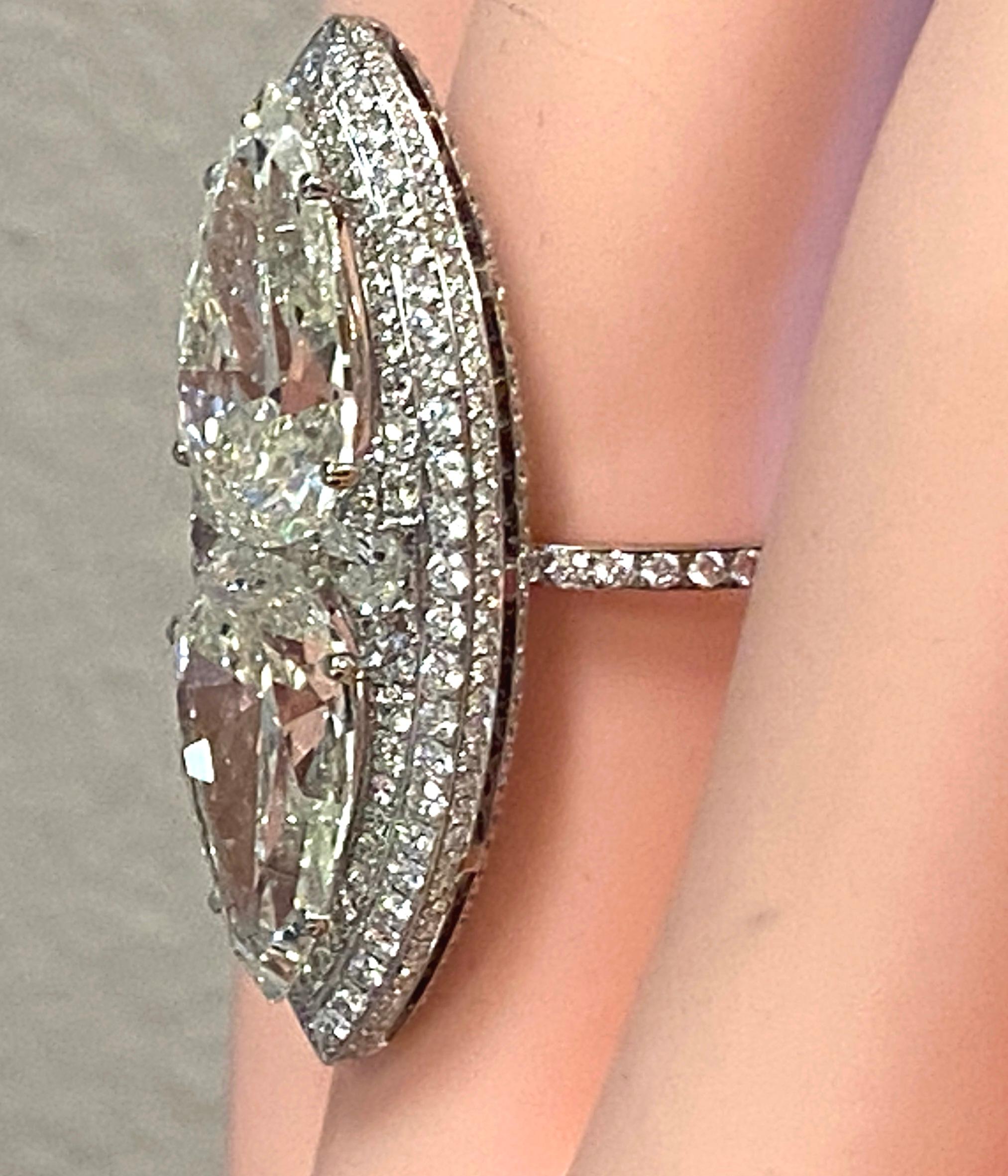 Pear Cut Large Marquise Shaped Ring Featuring 2 5+ Carat Pear Shaped Diamonds For Sale