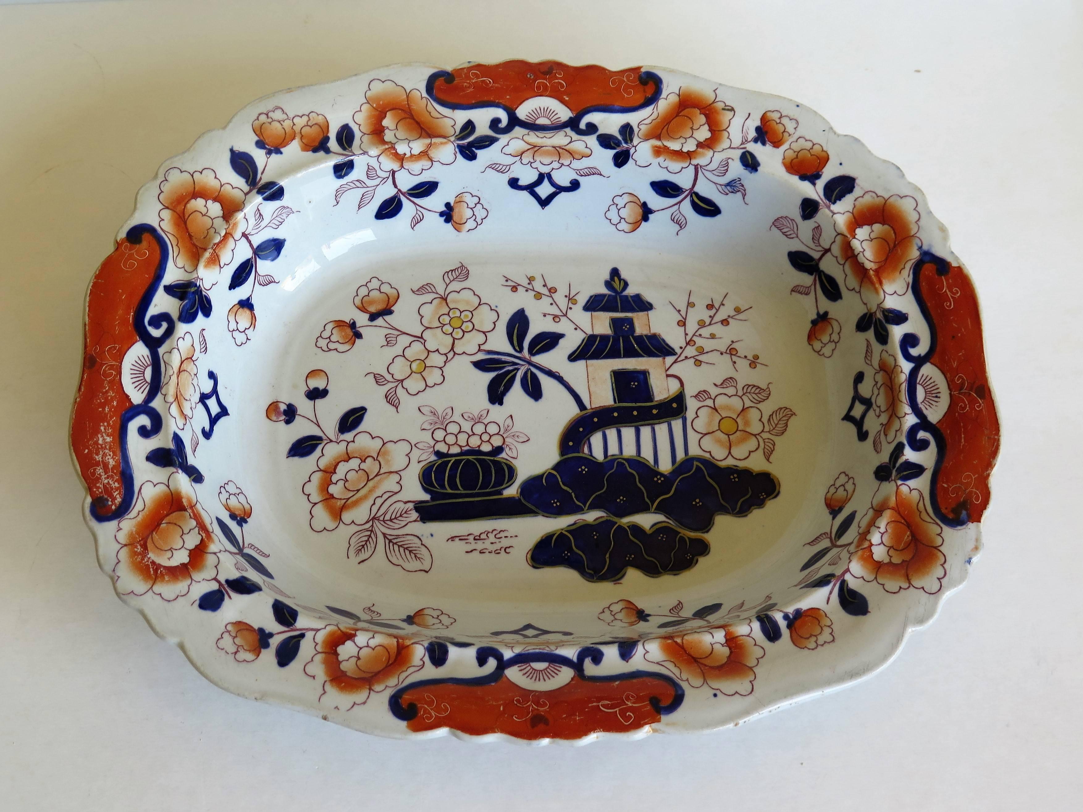 This is a very attractive Mason's Ironstone large Dish made during the mid-19th century, when Mason's was owned by Ashworth Brothers, circa 1865.

The dish has a good Chinoiserie pattern, number 124, depicting a pagoda scene by rocks with a large