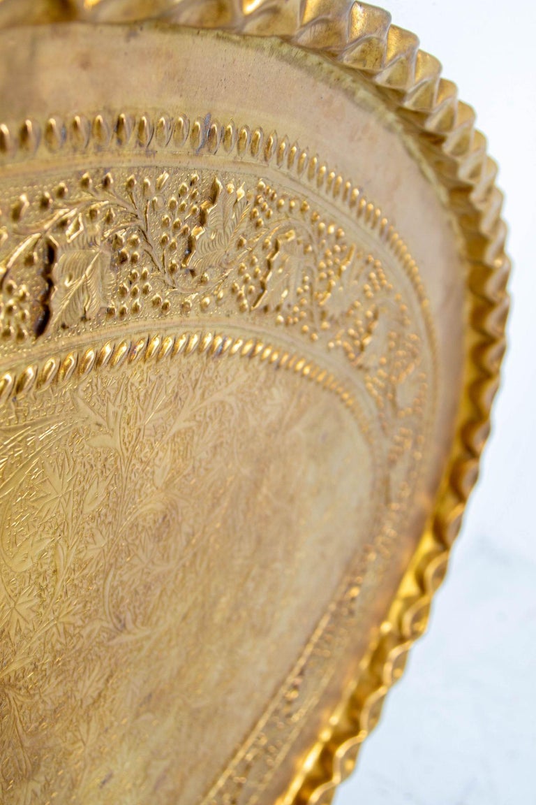 This hand-crafted oval brass tray, featuring a faux bamboo brass