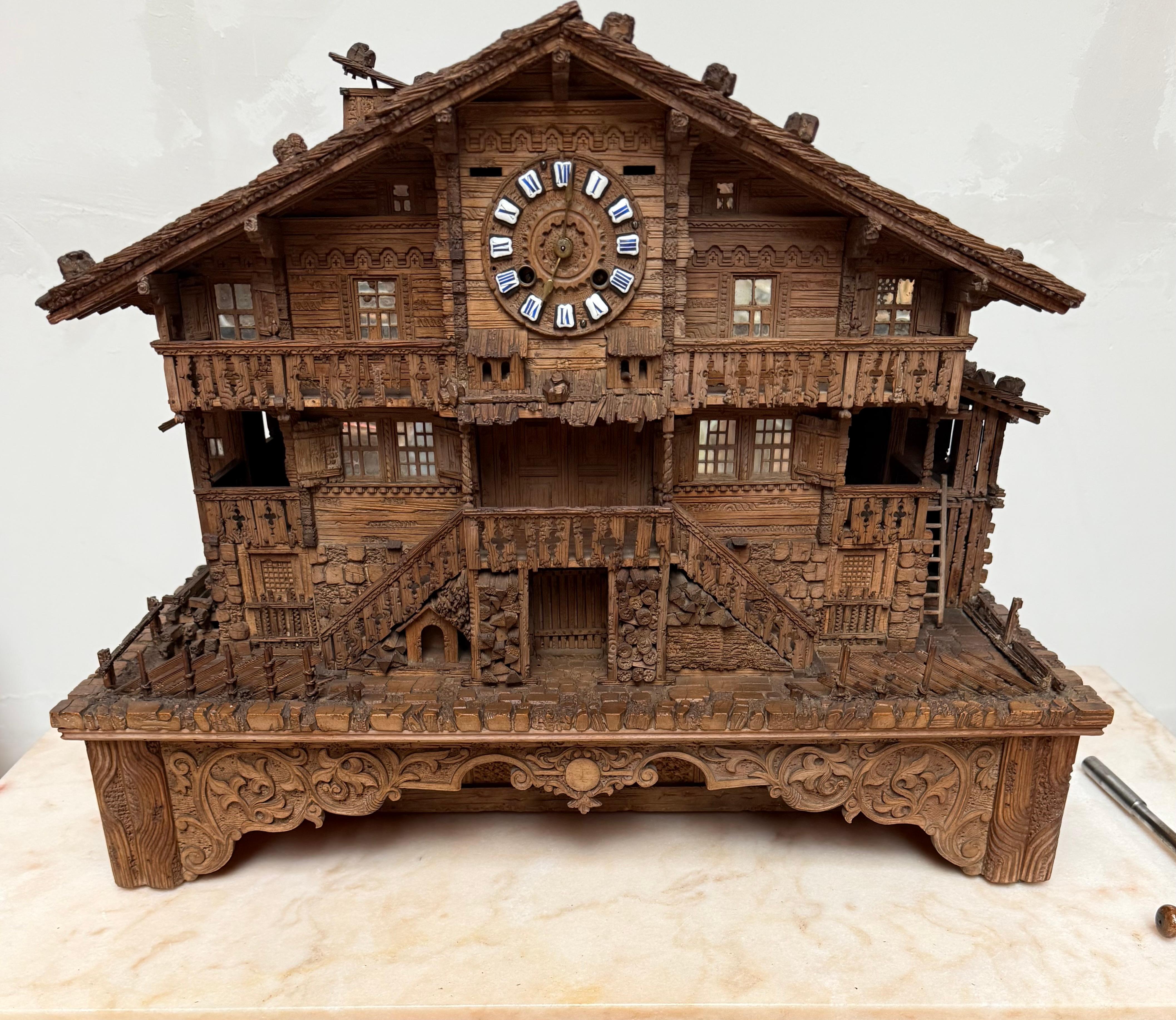 Large Masterly Carved Swiss Black Forest Nutwood Chalet with Clock and Music Box For Sale 11