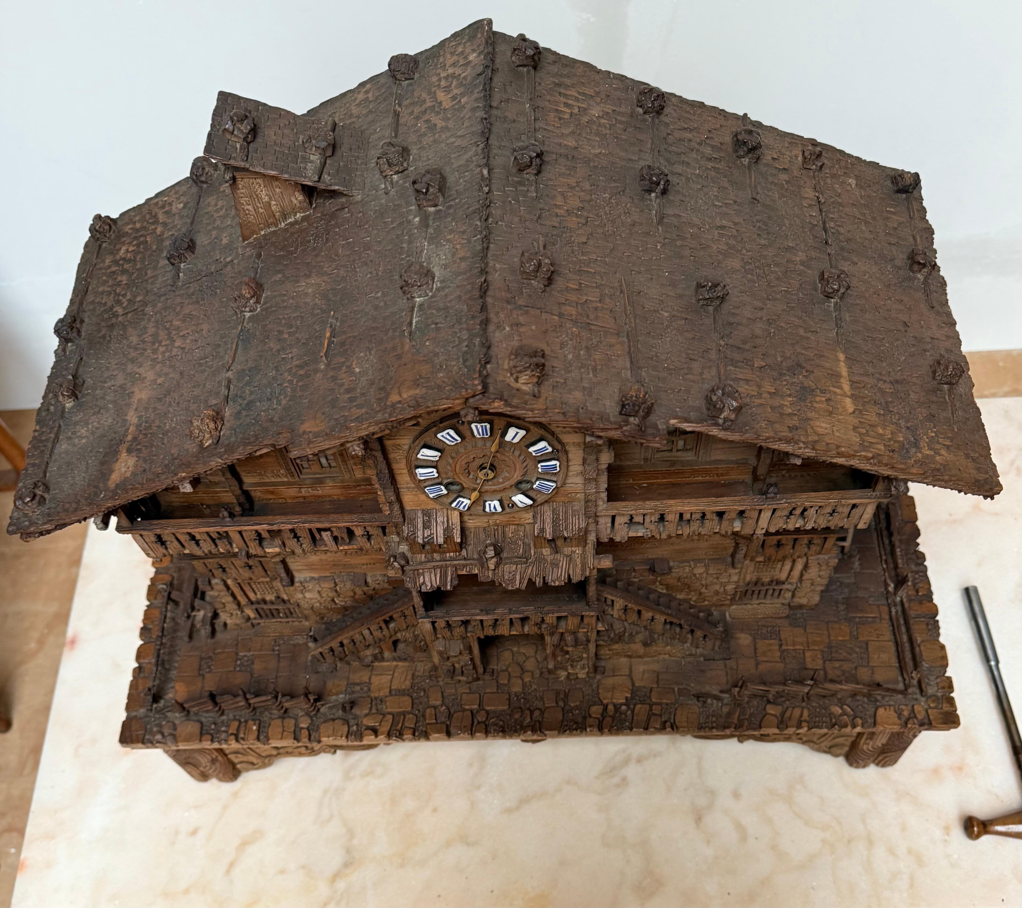Patinated Large Masterly Carved Swiss Black Forest Nutwood Chalet with Clock and Music Box For Sale