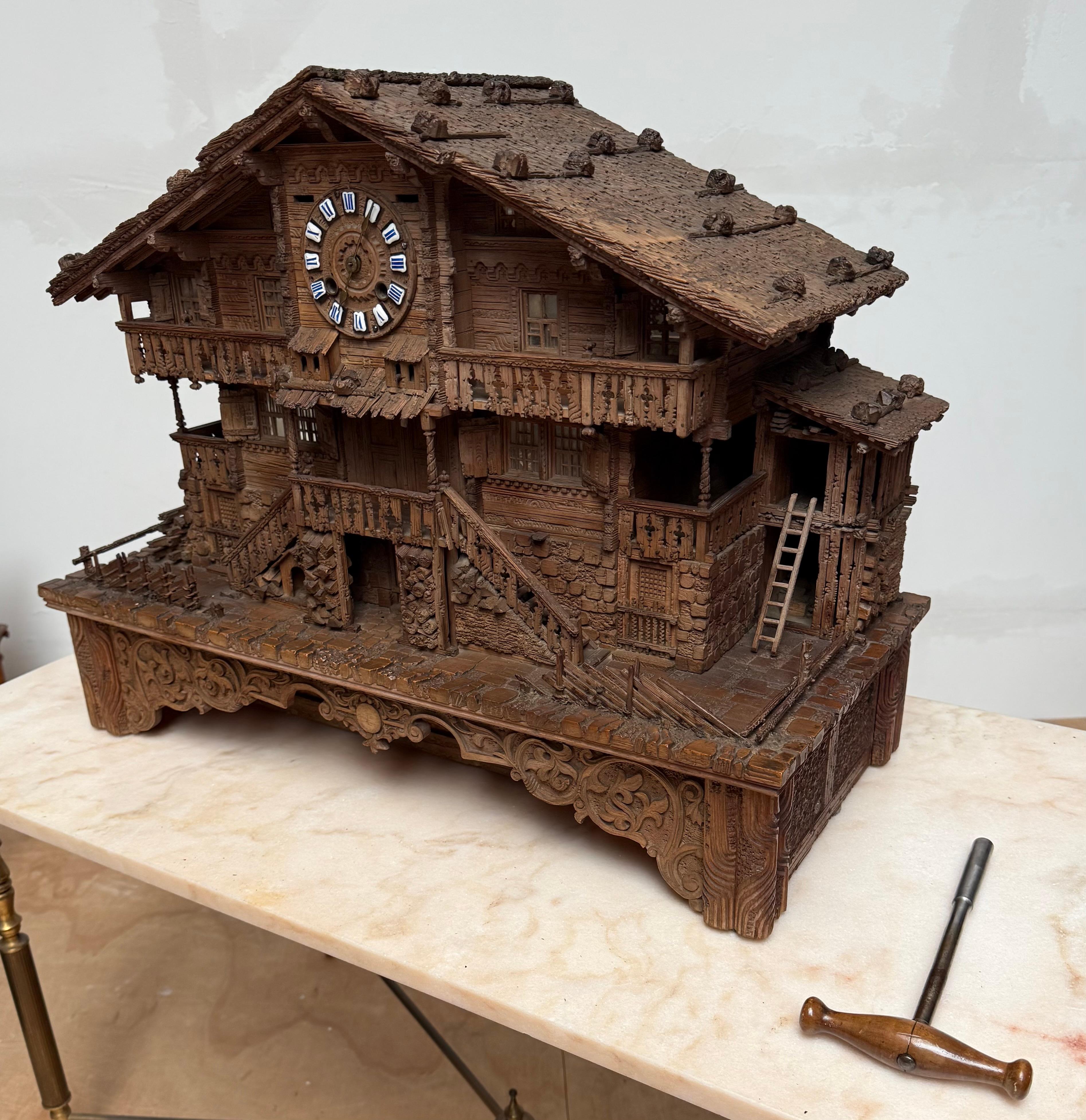Large Masterly Carved Swiss Black Forest Nutwood Chalet with Clock and Music Box In Good Condition For Sale In Lisse, NL