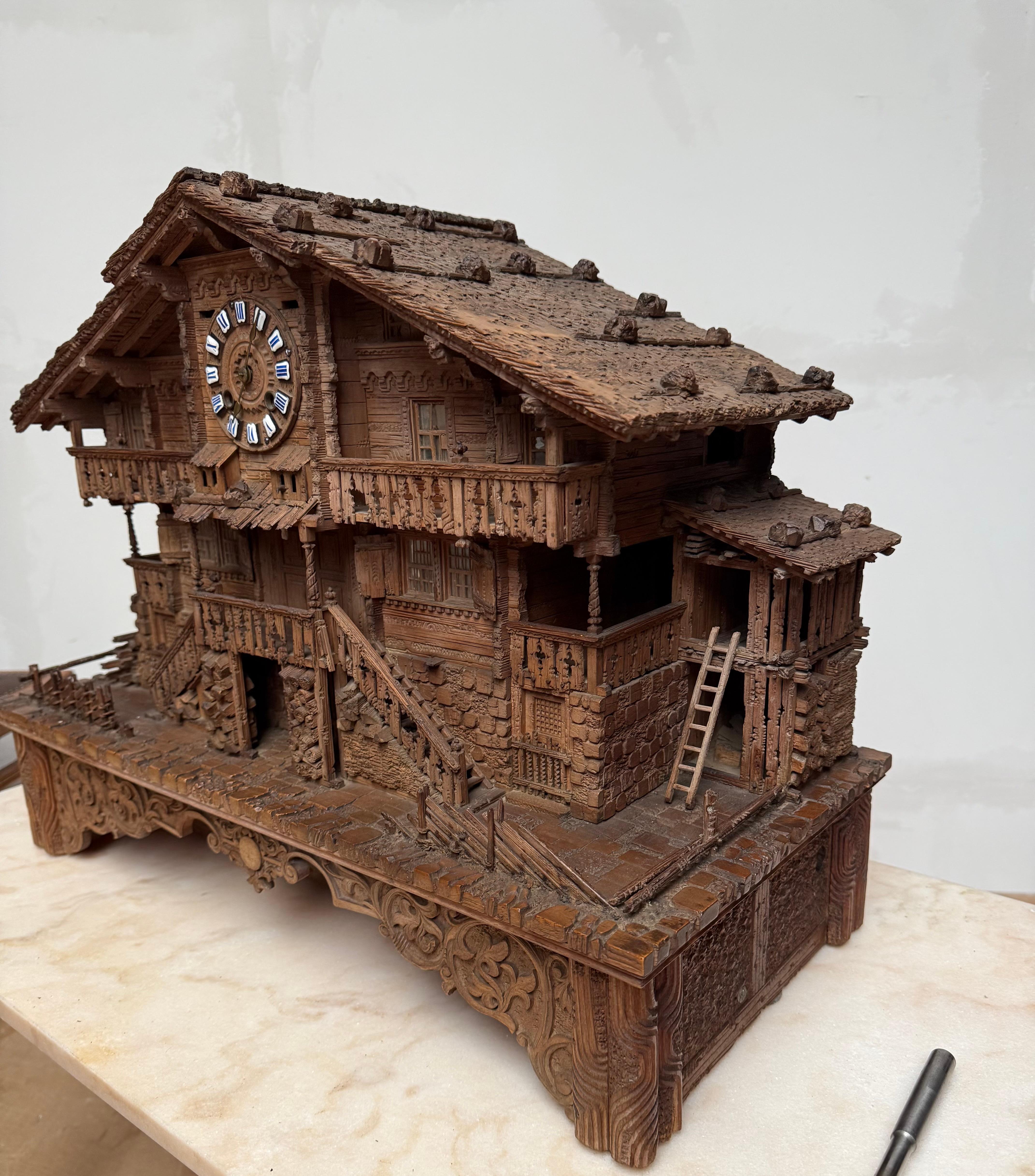 19th Century Large Masterly Carved Swiss Black Forest Nutwood Chalet with Clock and Music Box For Sale