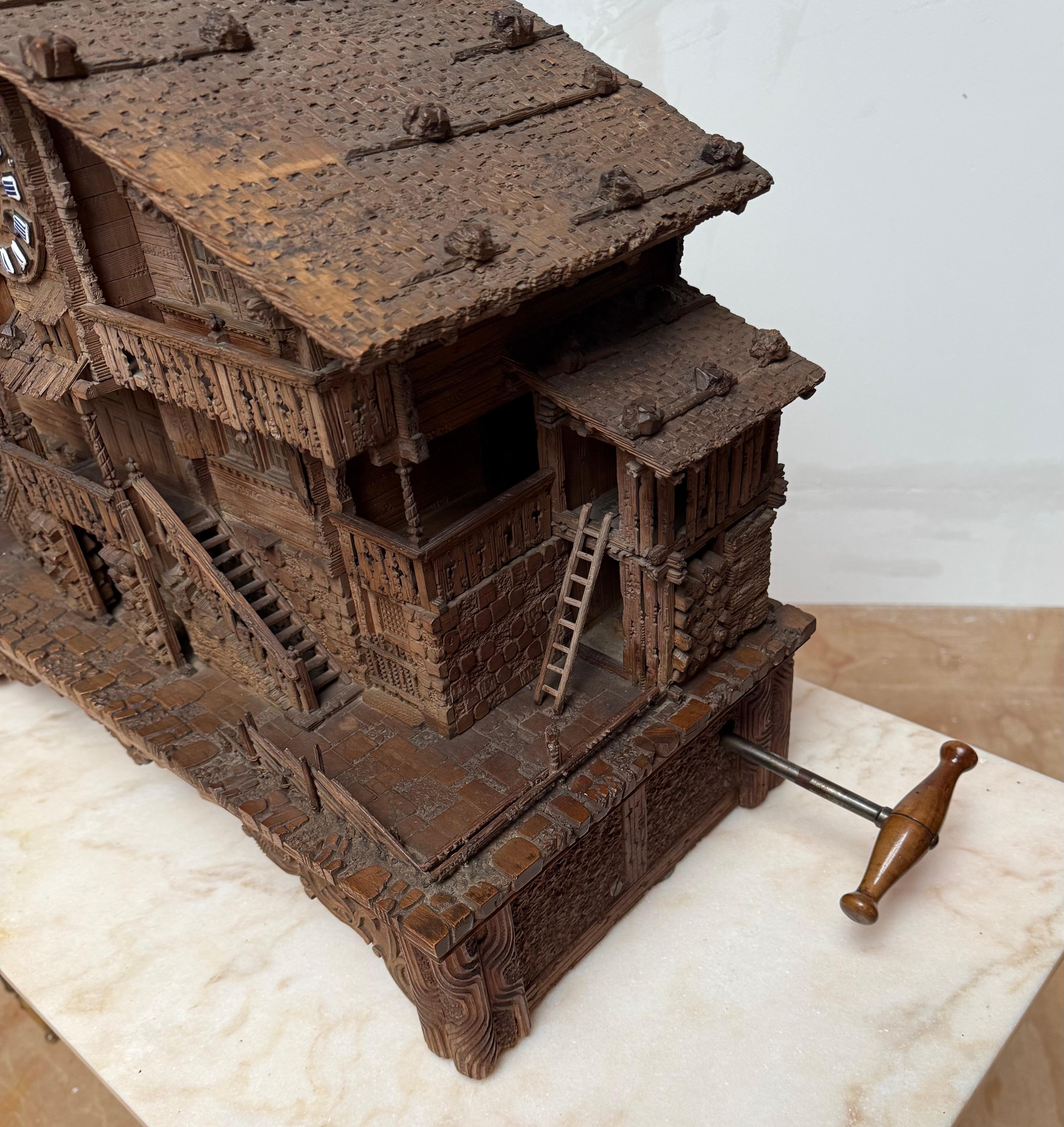 Enamel Large Masterly Carved Swiss Black Forest Nutwood Chalet with Clock and Music Box For Sale