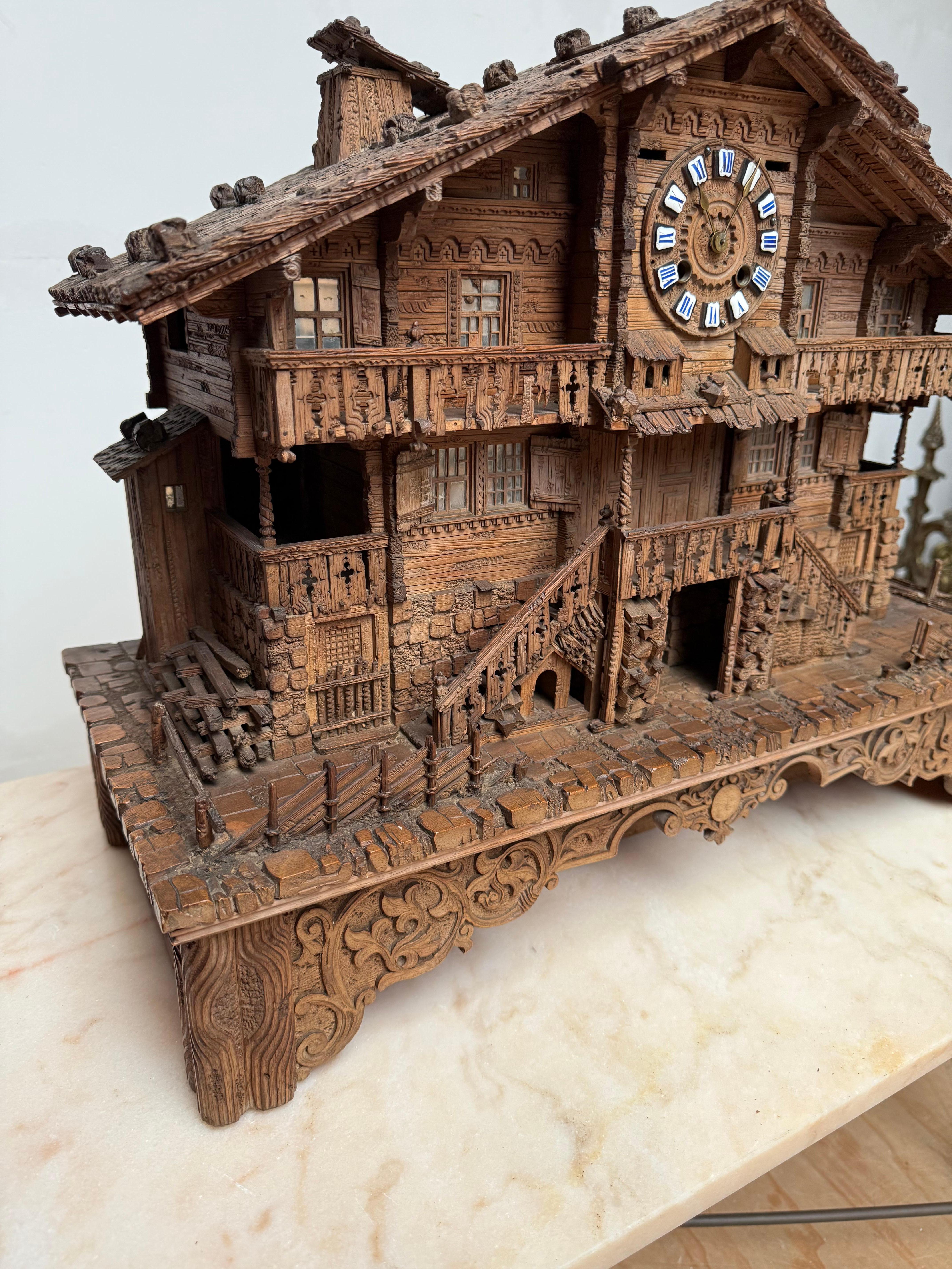 Large Masterly Carved Swiss Black Forest Nutwood Chalet with Clock and Music Box For Sale 1