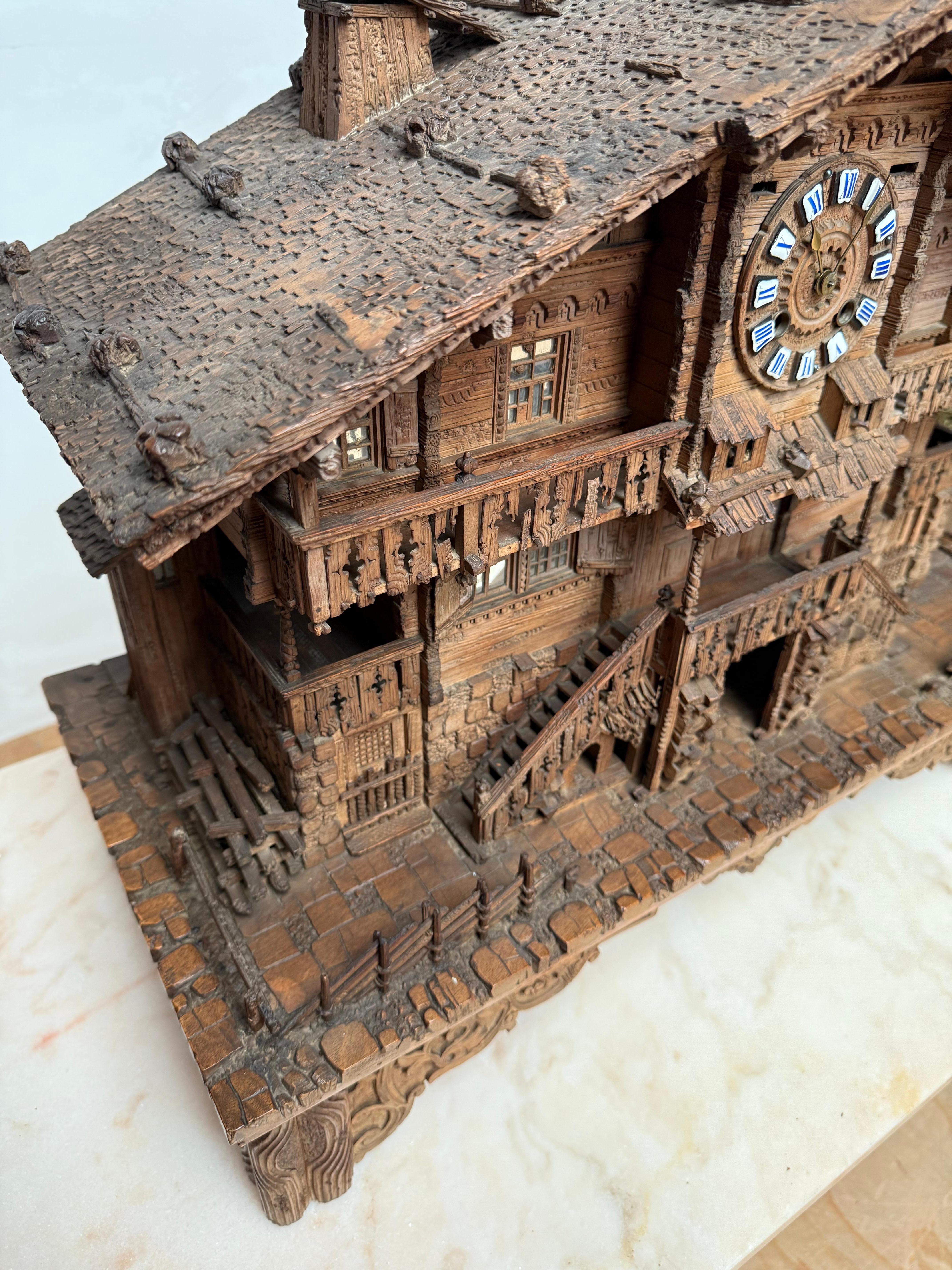 Large Masterly Carved Swiss Black Forest Nutwood Chalet with Clock and Music Box For Sale 2