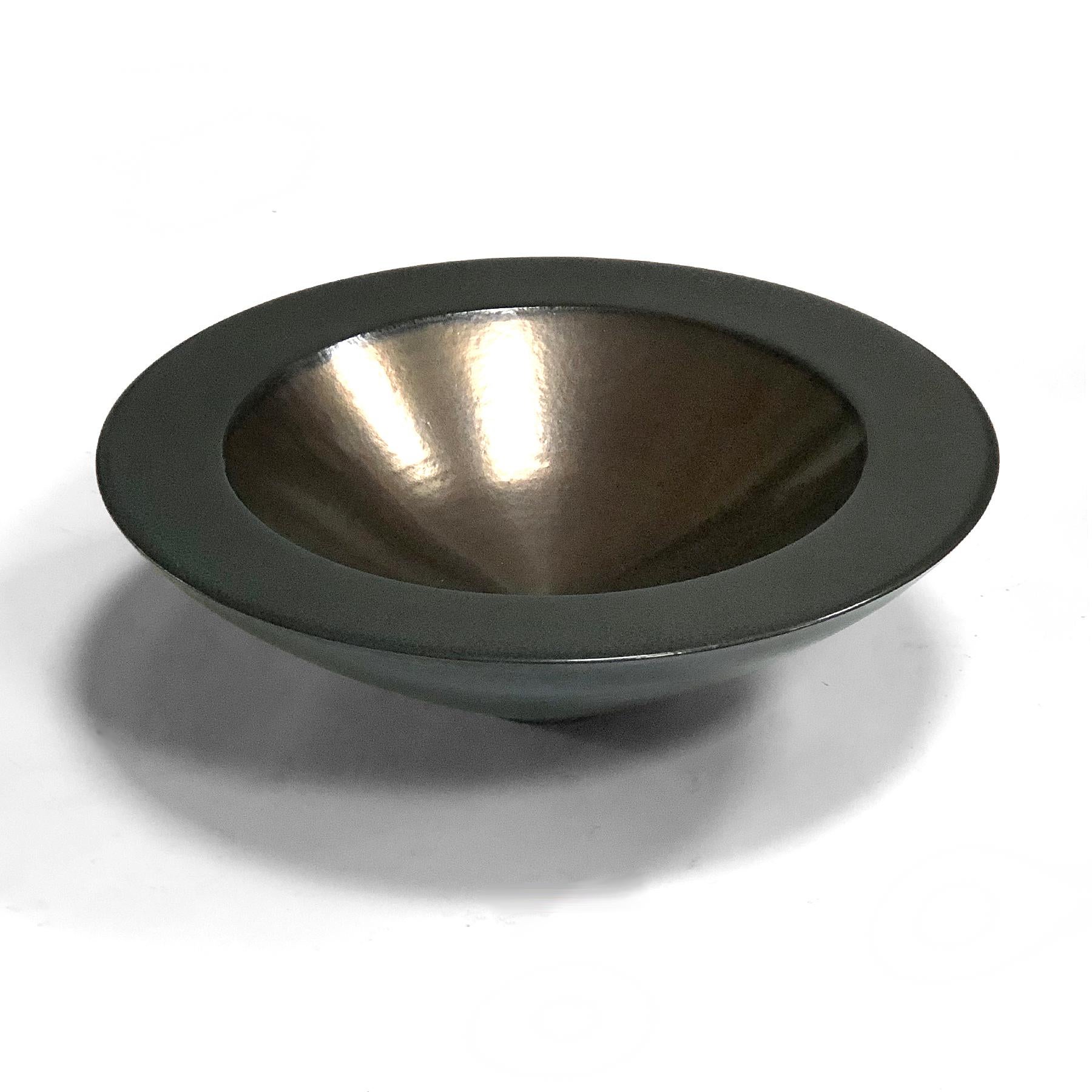 This large and striking bowl by Masuo Ojima (b 1949) has a beautiful deep emerald green glaze on the exterior and gunmetal on the interior. The wonderful physical presence makes it a terrific centerpiece.