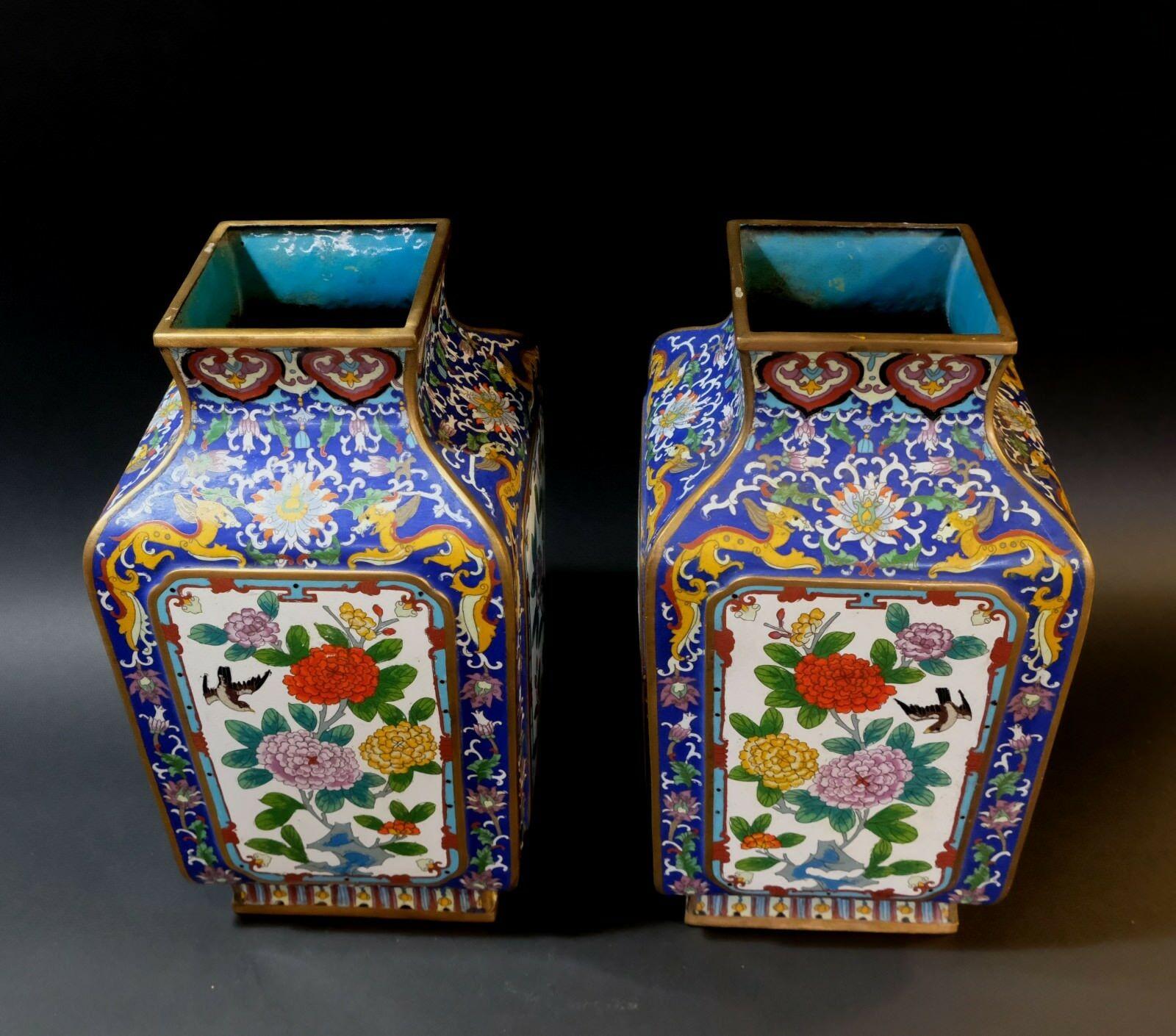 Quality work, large & heavy matching pair of chinese bronze cloisonné enameled vases. Of squared four-panel form, each panel with raised scenes of birds and florals on a blue ground with dragons and interlocking foliage.