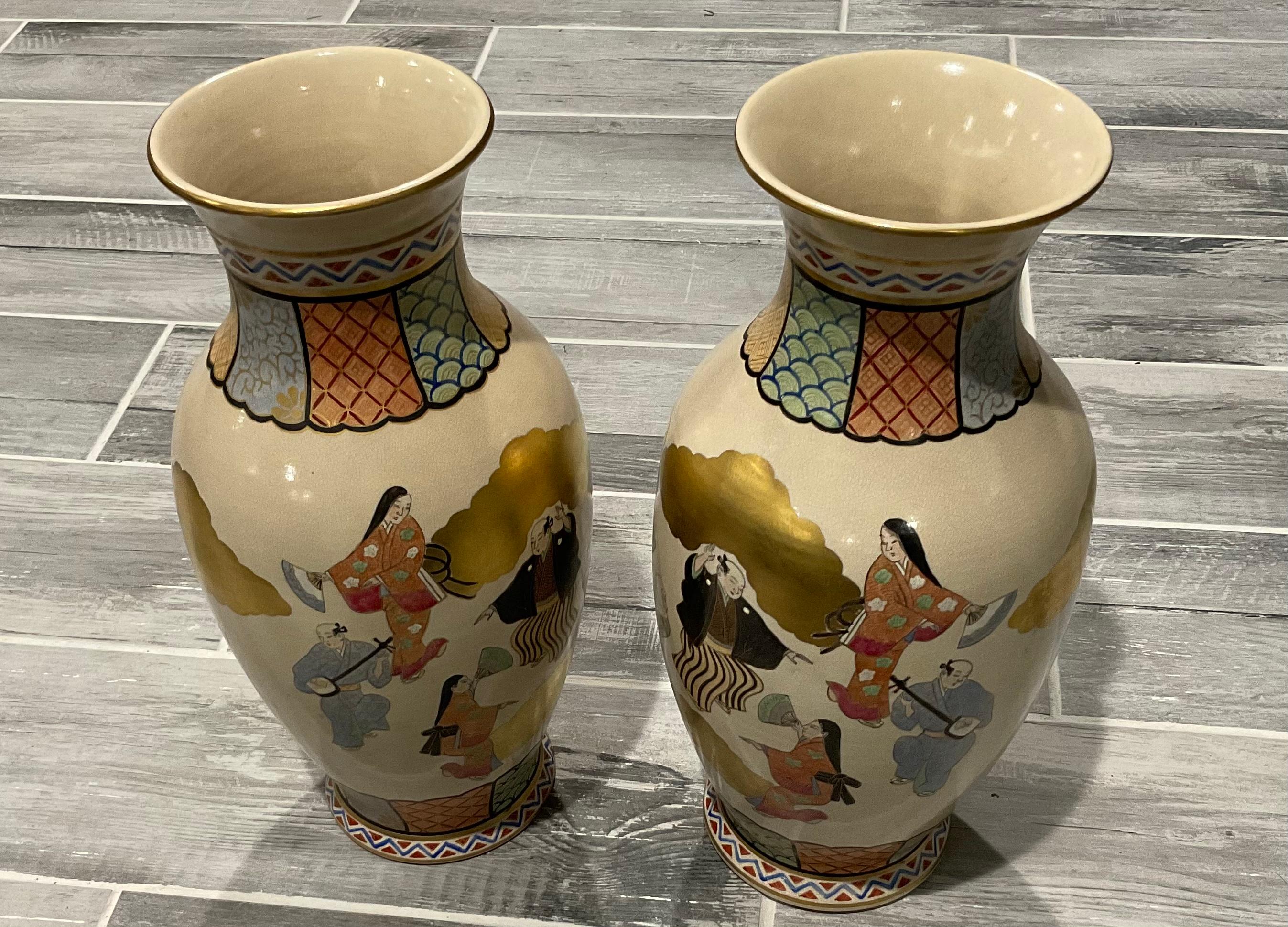 LARGE Matching Pair Satsuma Meiji Era Figural vases figures in clouds gold leaf. Amazing multi color decoration. Vases display prominently from any decoration.