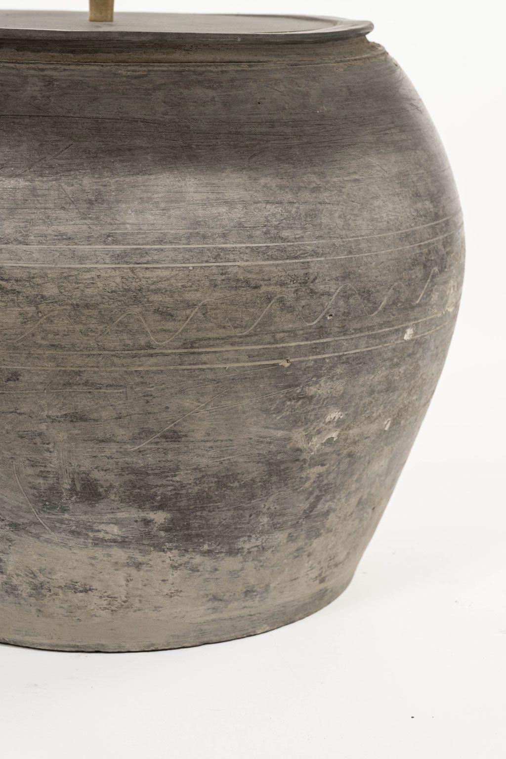 Large matte black unglazed lamp with white linen shallow drum shade (listed measurements include shade) and line switch. Hand-made pottery lamp. Newly wired for use within the USA with uno socket. Makes nice near-pair with a slightly smaller second