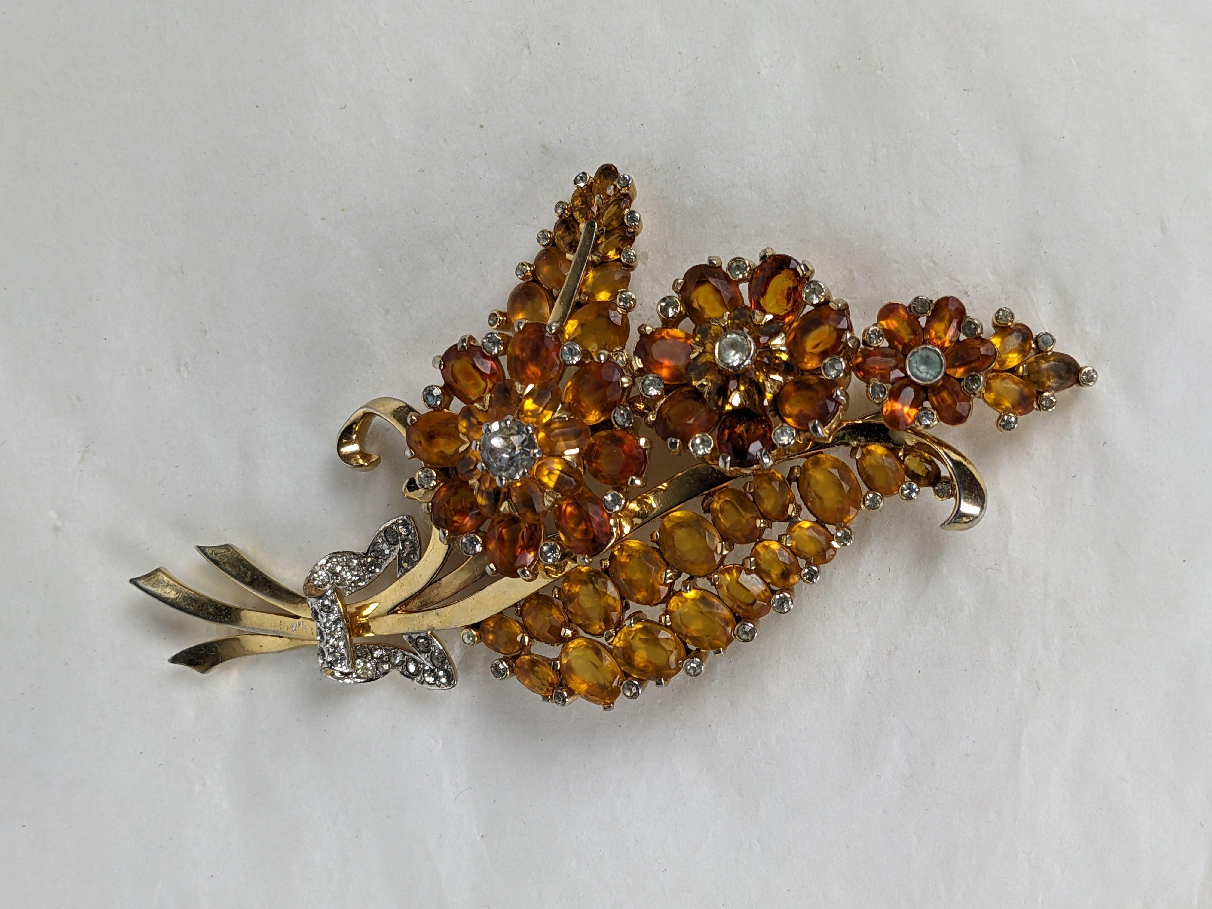 Retro Large Mazer citrine leaf and topaz triple flower head floral brooch with crystal pave bow. Of gold plate base metal, crystal rhinestones and faceted paste oval stones. L 4.5