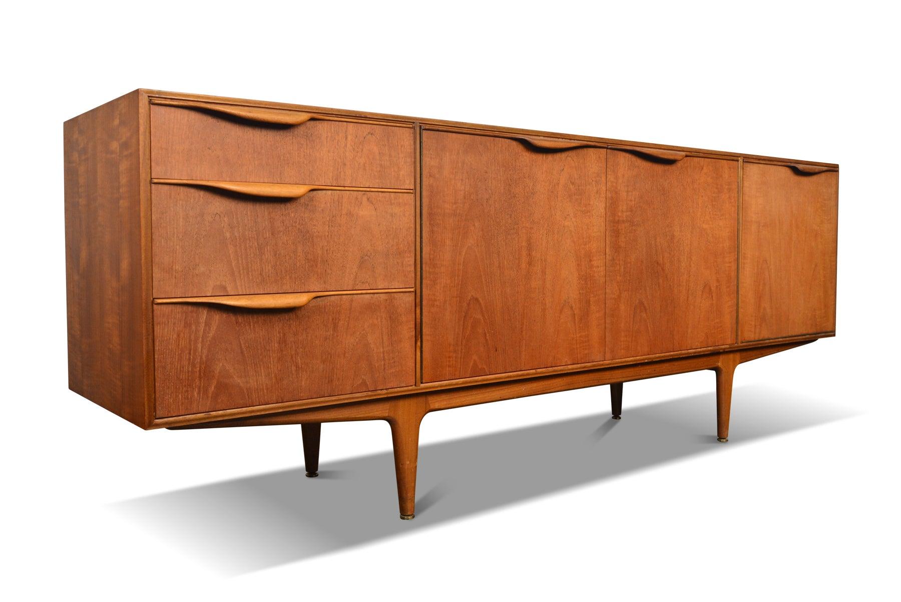 Origin: Scotland
Designer: Val Rossi
Manufacturer: McIntosh
Era: 1960s
Materials: Teak
Dimensions: 79” wide x 18” deep x 30” tall

Condition: In good original condition with light cosmetic wear. Price includes refinishing /