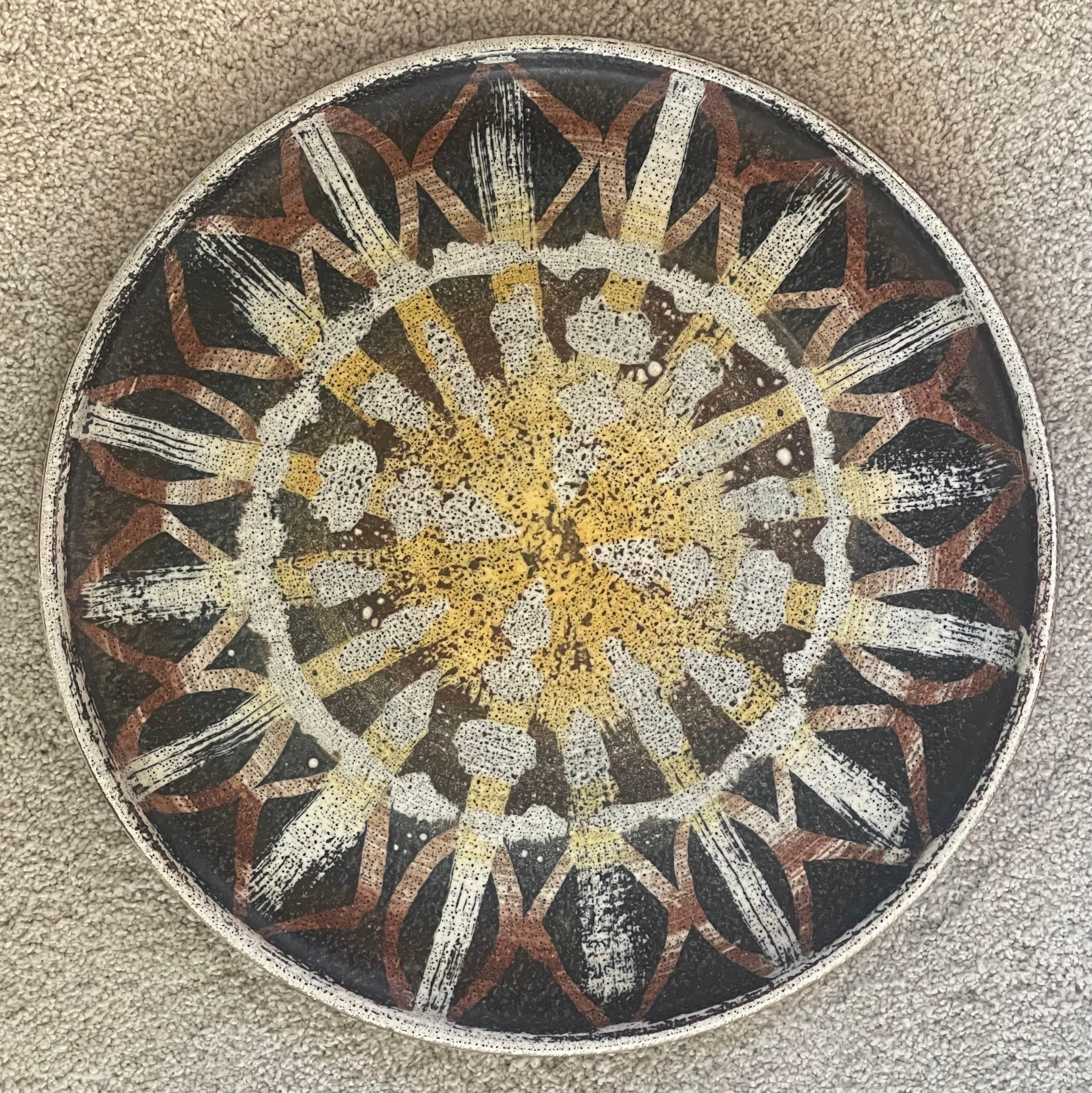 A very nice California studio pottery charger, circa 1970s. The piece is signed on the reverse and in excellent vintage condition with no chips or cracks. The piece measures 14.75