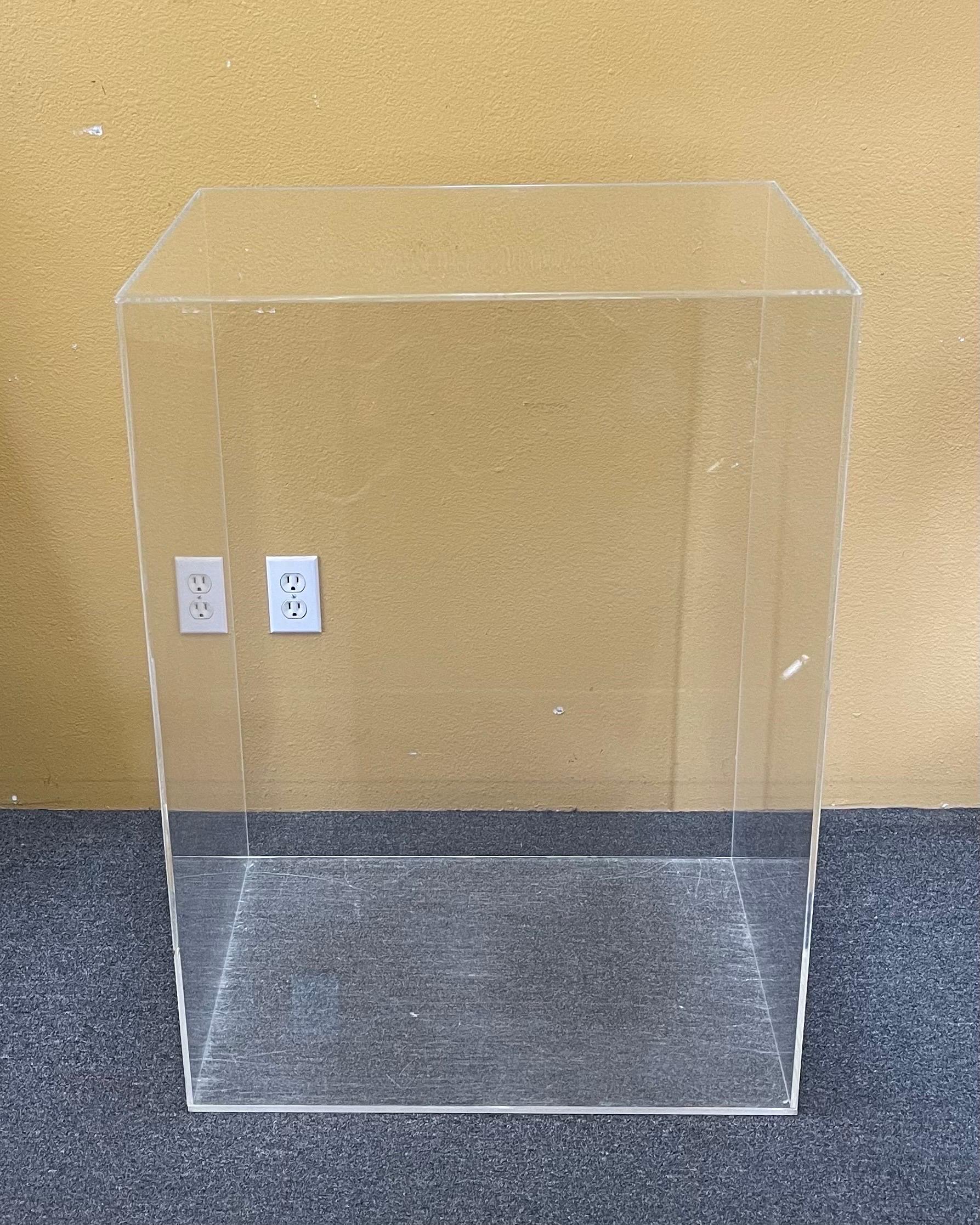 A large MCM rectangular lucite pedestal, circa 1970s.  The piece is in good vintage condition and measures a substantial 26