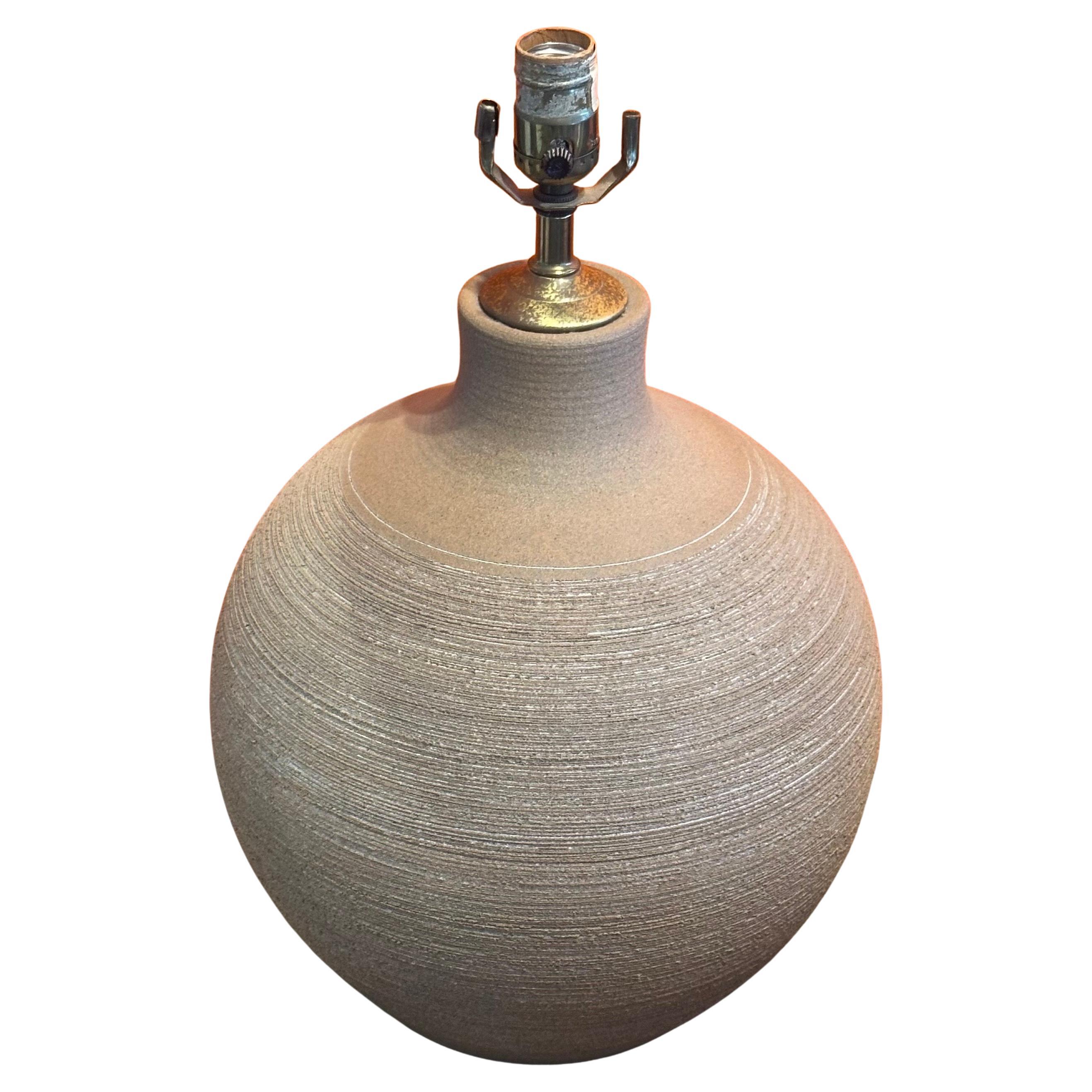 Beautiful large MCM studio pottery stoneware table lamp by Larry & Terry Brown, circa 1970s.  The lamp is in very good working condition and measures 12