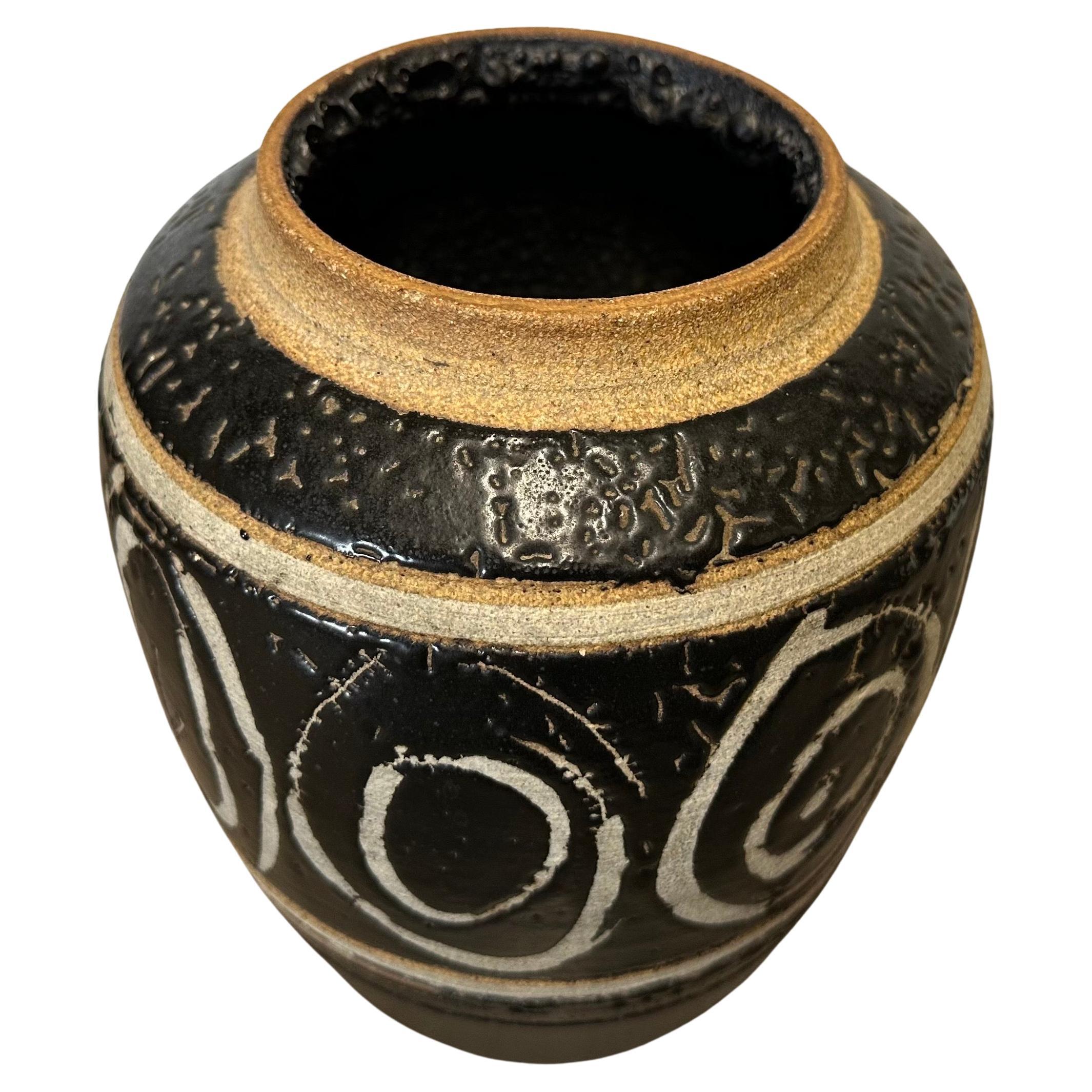 Large MCM studio pottery vase with a volcanic rock finish, circa 1970s. The vase is in very good condition with no chips or cracks and measures approximately 9