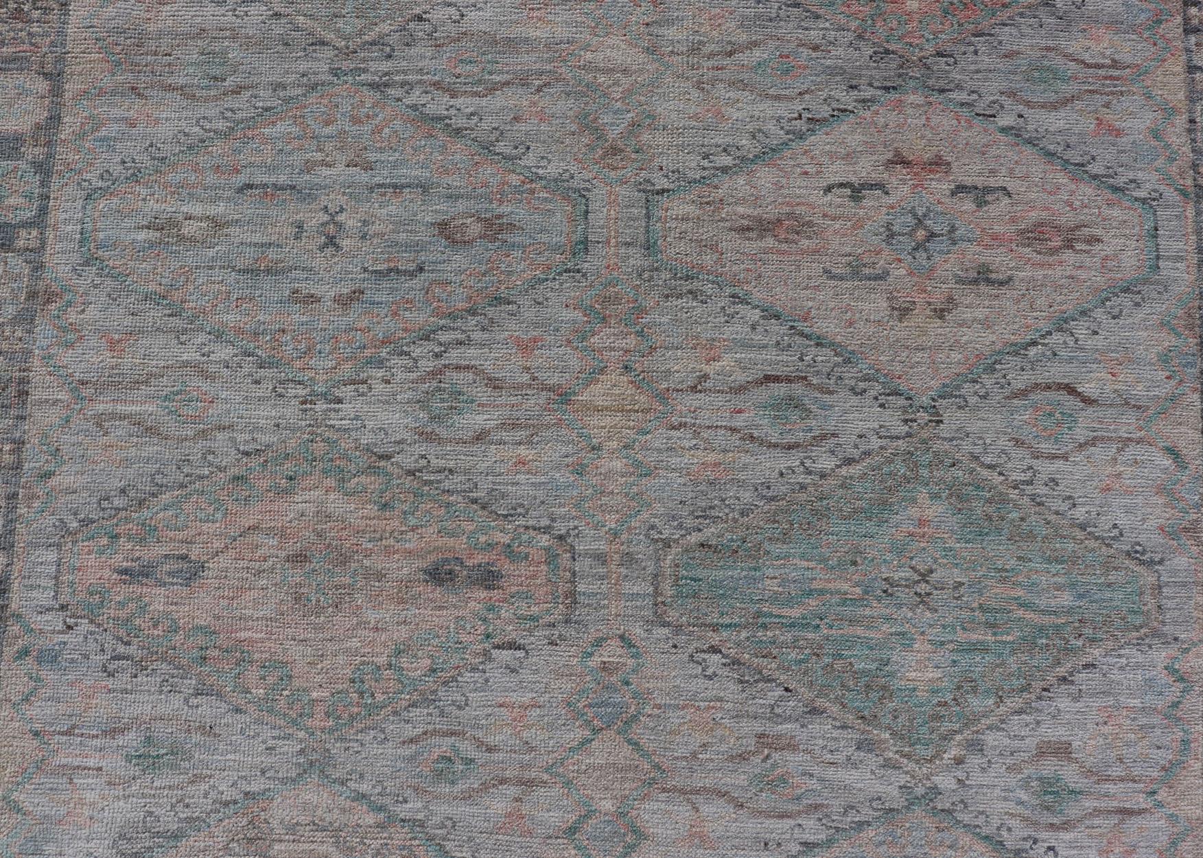 Measures: 4'11 x 6'3 
Large Medallion Design Modern Oushak on a Light Blue Field With Multi Colors. Keivan Woven Arts; rug AWR-12297 Country of Origin: Afghanistan Type: Oushak Circa 2020 
This modern Oushak features large medallions in the center