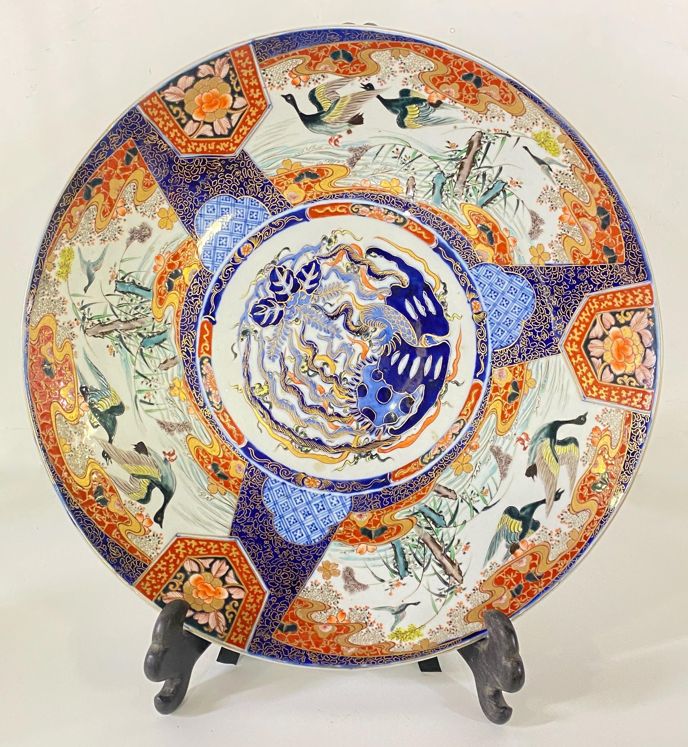 A large and very fine quality late 19th century Japanese porcelain charger. Having classical motif hand painted decoration to the border with wonderful orange and blue colors.
In lovely antique condition.
Japan, Meiji period. 
