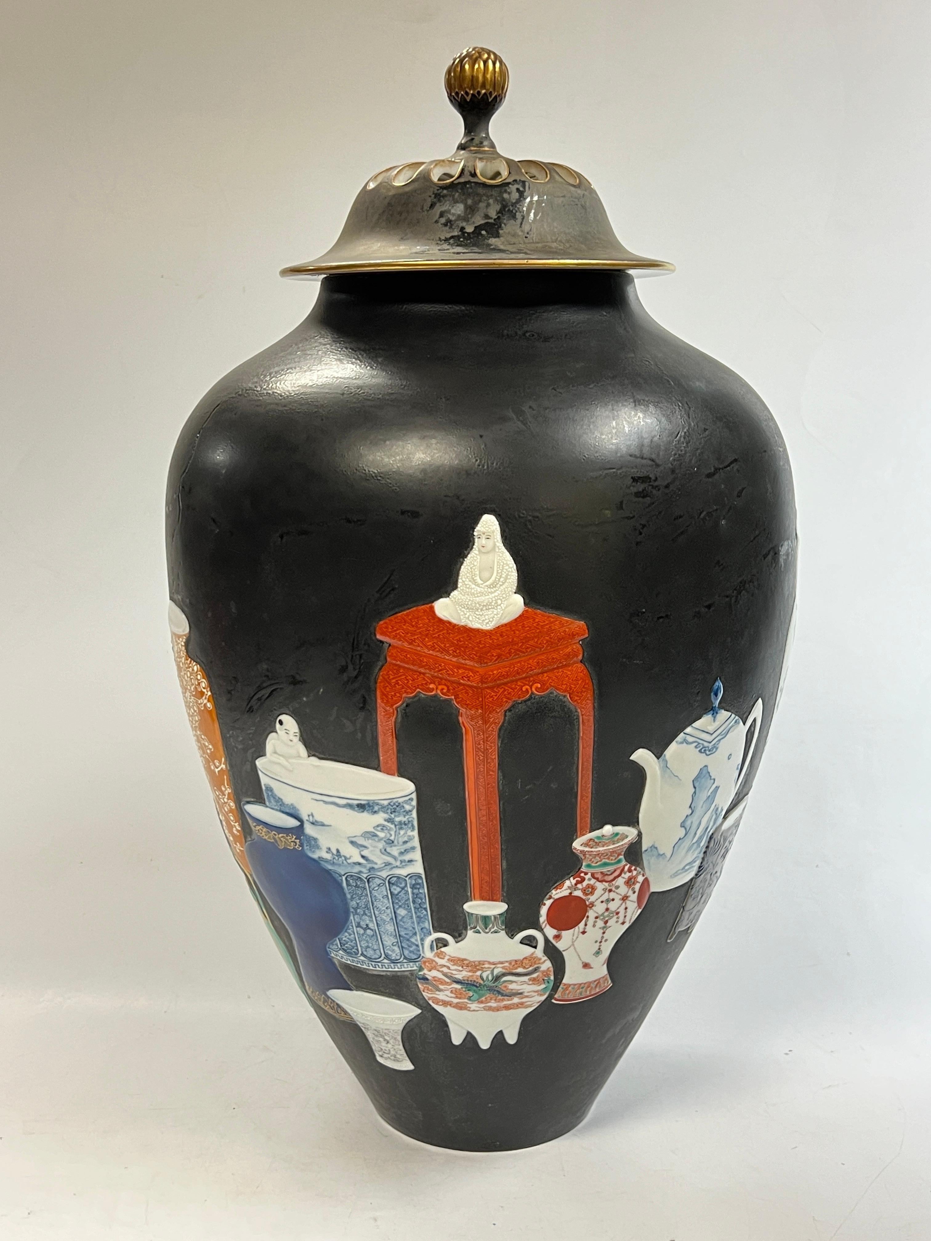 Very unique Kutani Japanese porcelain censer or pot pourri vase (or jar) with cover with matte black glazed finish and raised, moriage enameled designs of a variety of traditional forms, designs and glazes.  Underside with Kutani seal in black on