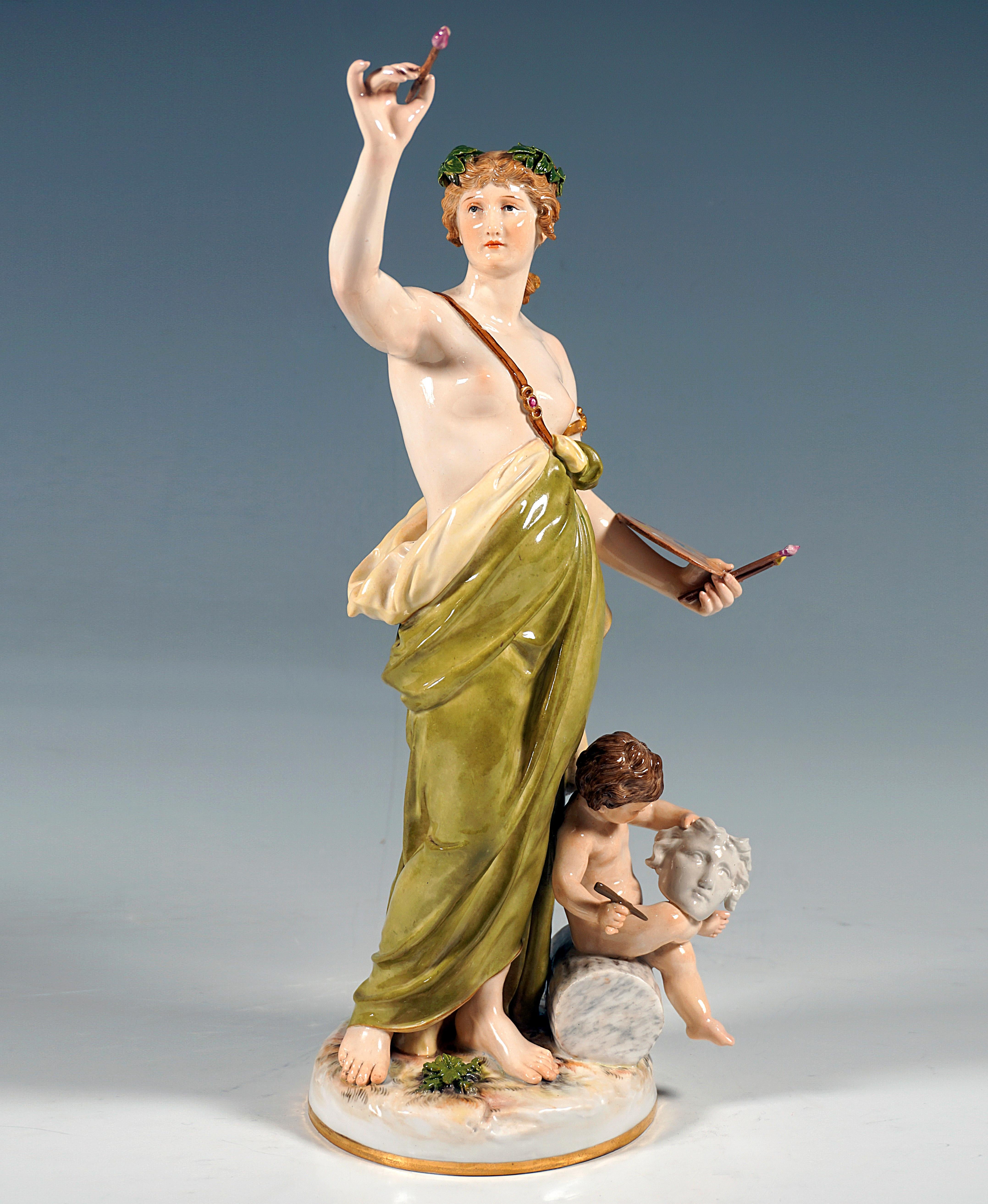 Extremely decorative full plastic depiction of a young beauty in classical style, with a bare breast, covering the bare abdomen with a large cloth held together with a shoulder strap set with gemstones, laurel leaves on the tied up hair, in the left