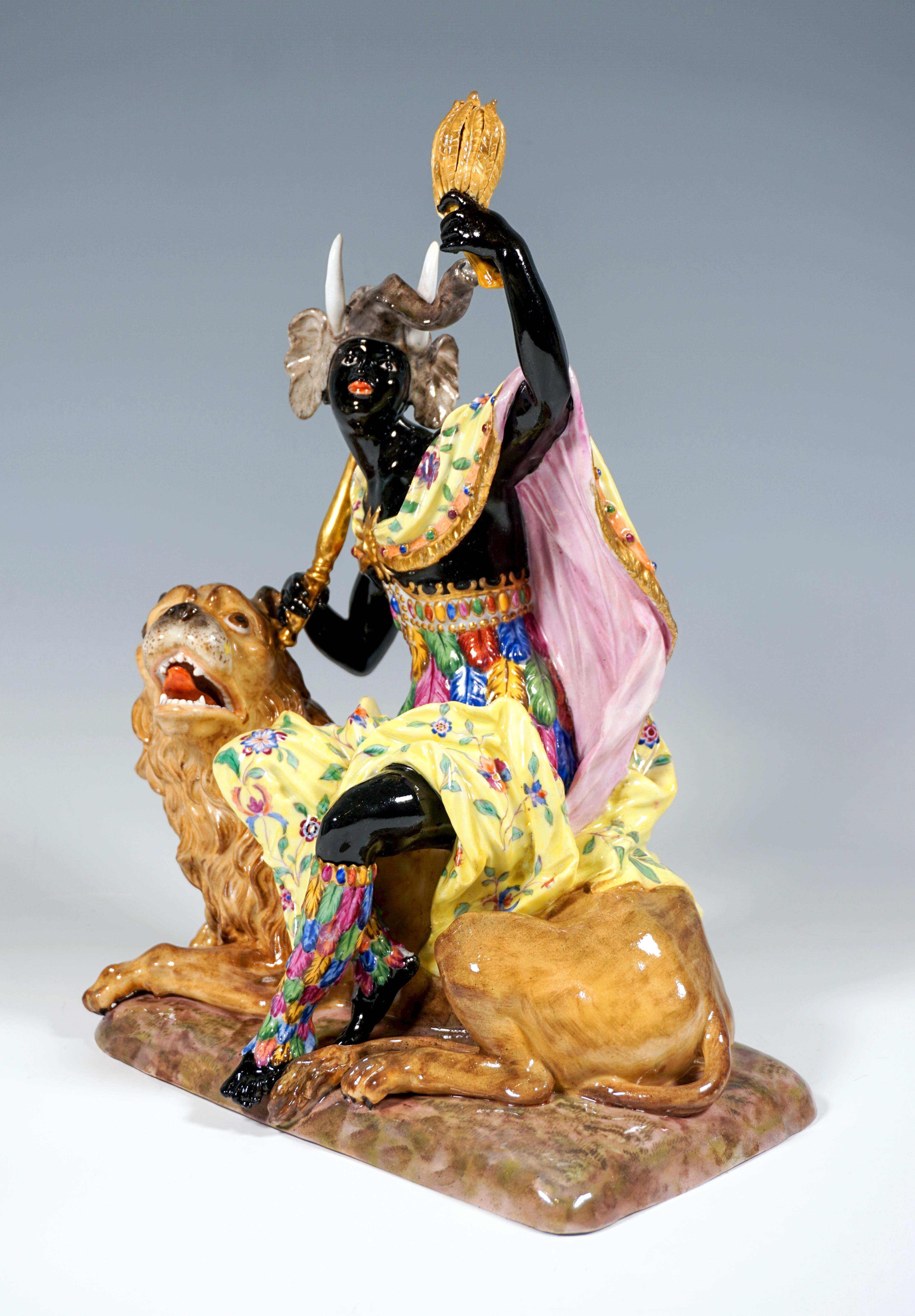 Personification of the continent of Africa as a dark-skinned woman who sits on a lion lying on the ground with its mouth open. Her waist and lower legs are dressed in brightly colored feathers, and her legs are wrapped in a wide skirt. Her shoulder