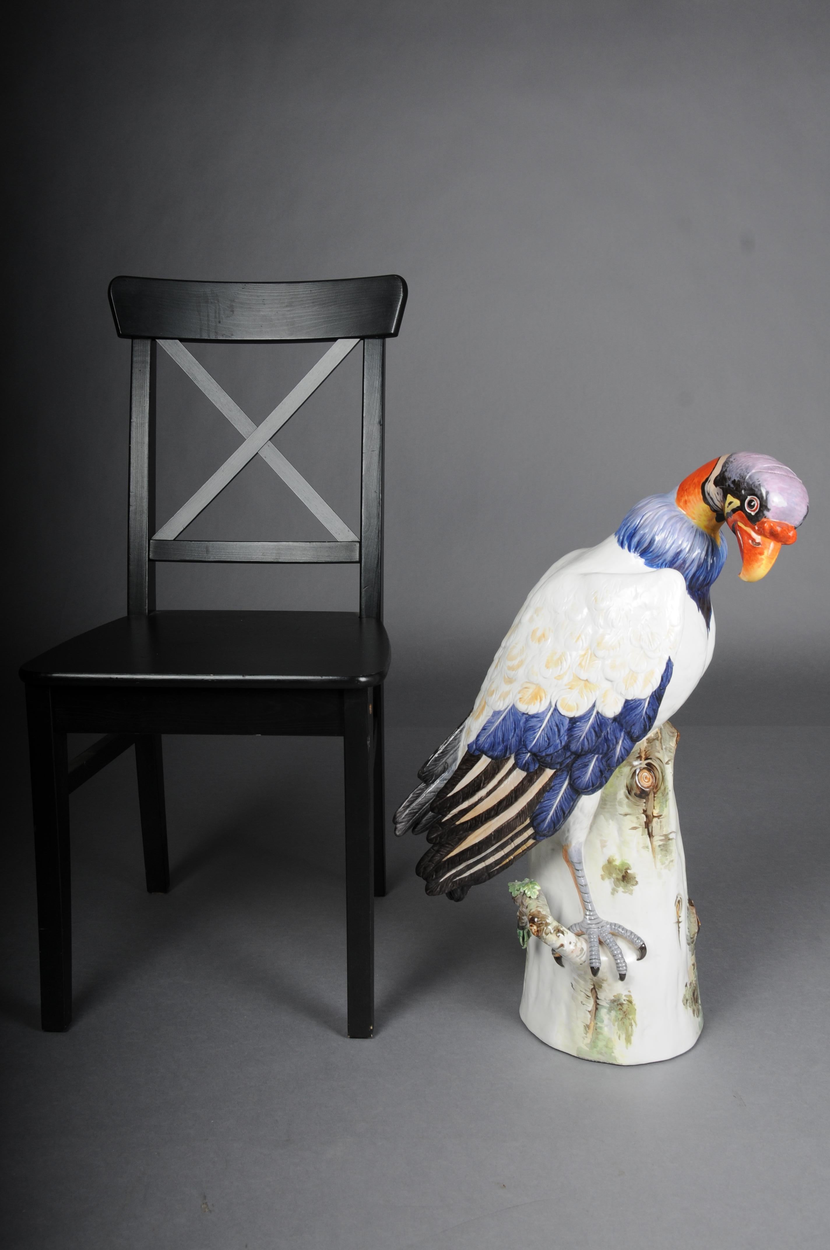 Large Meissen King Vulture standing on a tree trunk, around 1880

Large statuette depicting a king vulture sitting on a base modeled on a tree trunk decorated with foliage, with a slightly tilted head and rich polychrome natural decoration.

Based