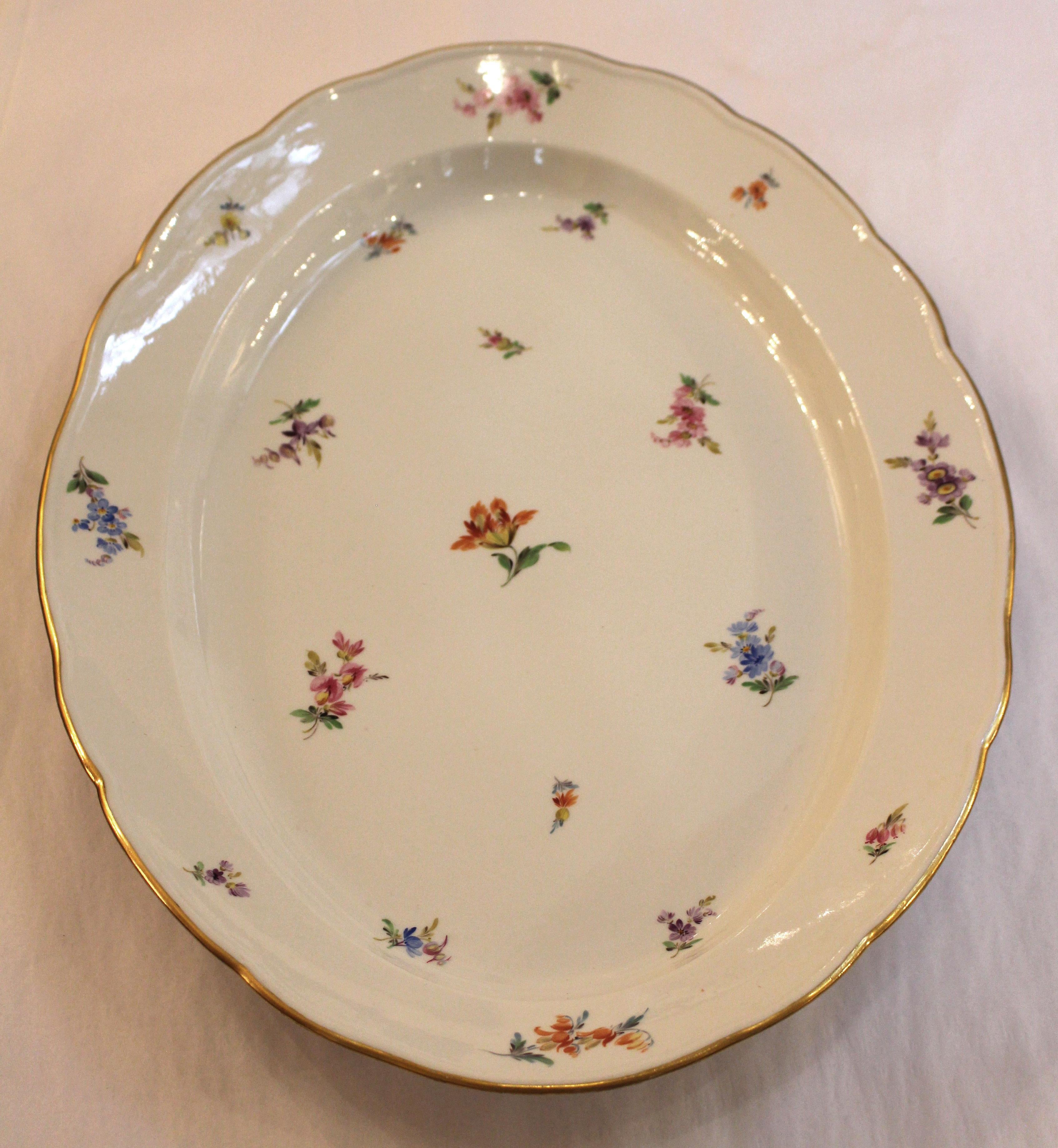 Large oval platter with gilt scalloped edge (minor wear) by Meissen in the scattered flowers or streublumen pattern. Crossed swords mark. c.1860-90. 19 1/4