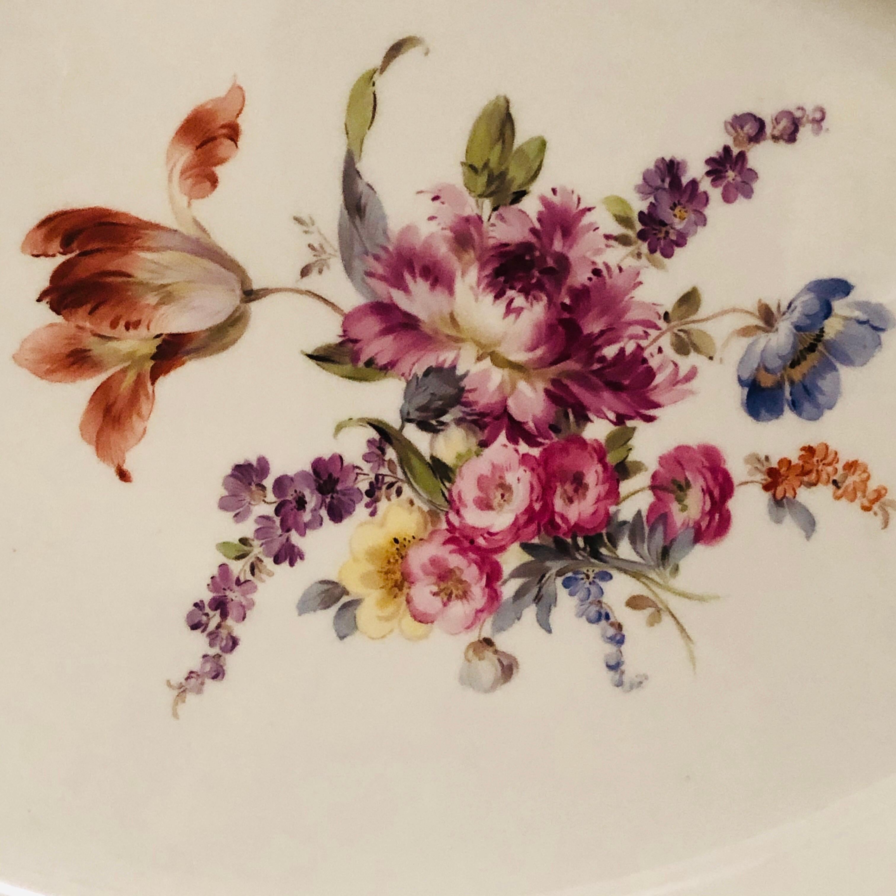 Large Meissen platter in the Neu Brandenstein pattern with a large beautifully painted bouquet of flowers in the center surrounded by smaller flowers and insects with a gilt rim. Neu Brandenstein is a wonderful pattern because the Meissen artists