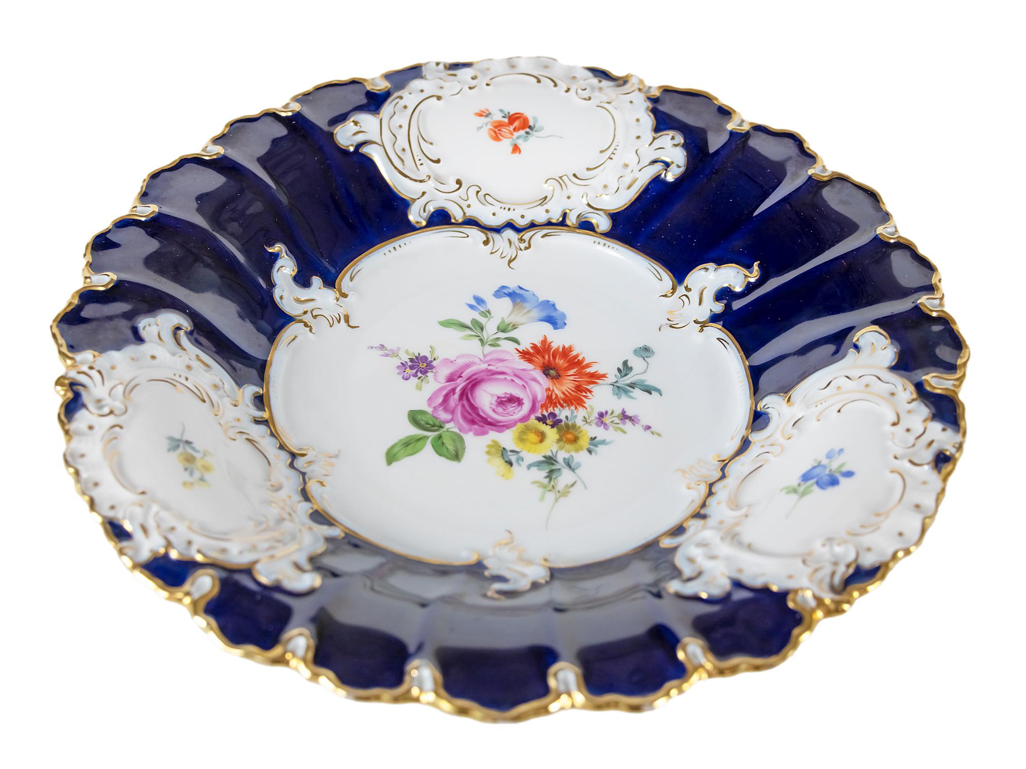 Large Meissen Porcelain plate with hand painted floral motives and cobalt blue color with gold decor.
 