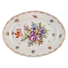 Large Meissen serving dish in porcelain with hand-painted flowers.