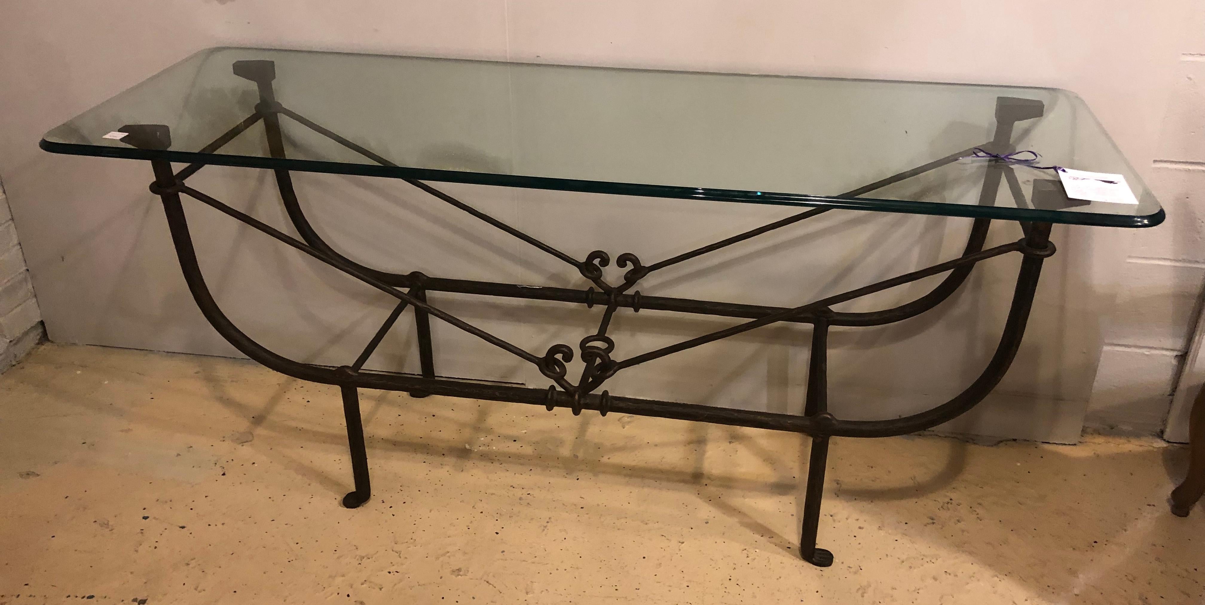 Large and impressive Metal Diego Giacometti style console table. The heavy strong and sturdy console or sofa table has a Giacometti form base supporting a finely beveled glass top.
Diego Giacometti (15 November 1902 – 15 July 1985) was a Swiss
