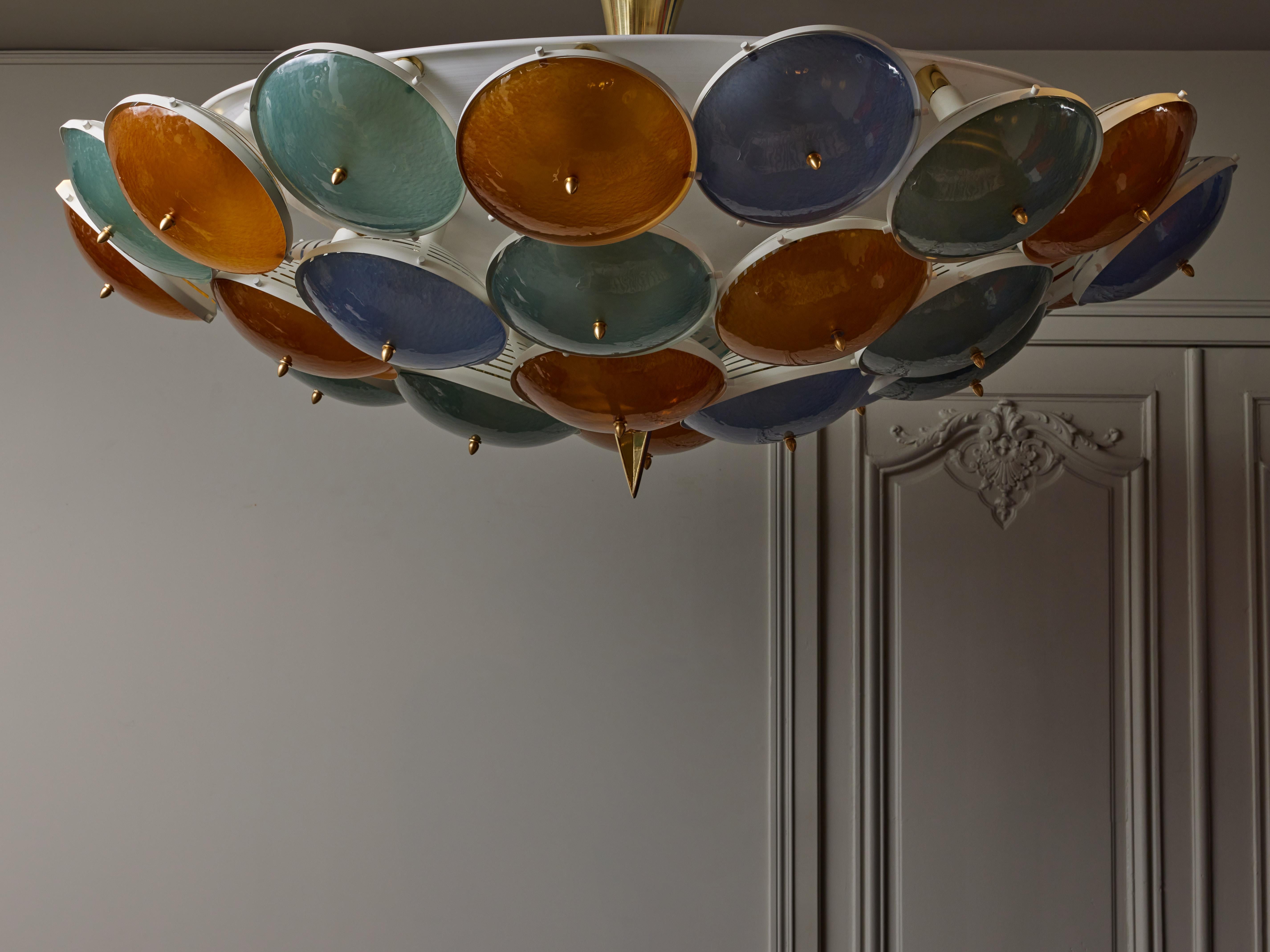 Exceptionally large flush mount made of a white metal structure supporting thirty sconces covered with coloured Murano glass lenses. Sixty sources of lights in total.