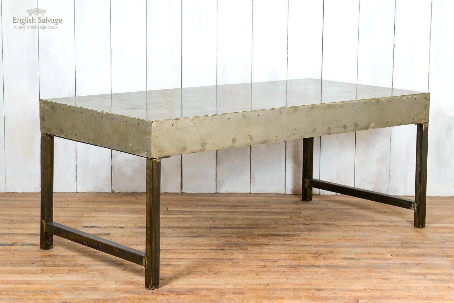 Industrial style polished metal table with faux rivet marks. Legs can be unbolted.
